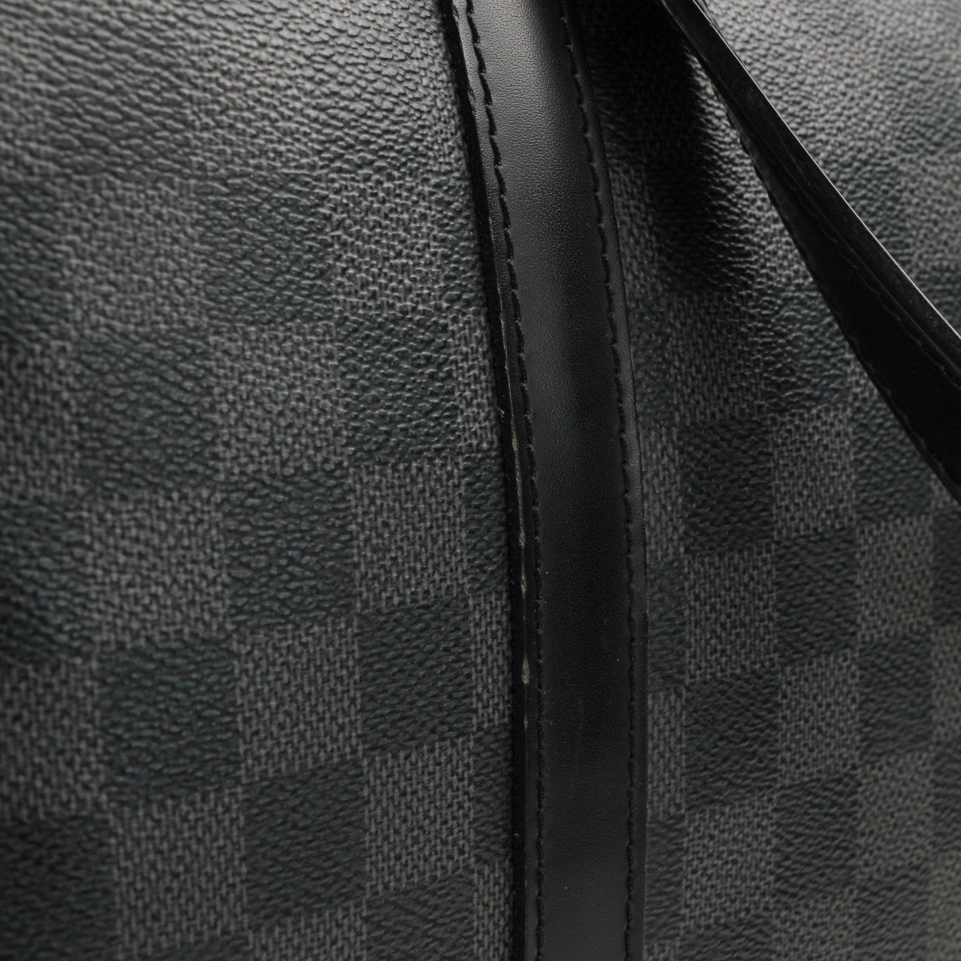 Louis Vuitton Tada Tote travel bag by Gold &amp; Beyond, stylish with leather handles and spacious interior for travel essentials.