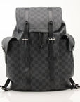 Louis Vuitton Christopher backpack in black leather, stylish travel bag with multiple compartments, by Gold & Beyond.
