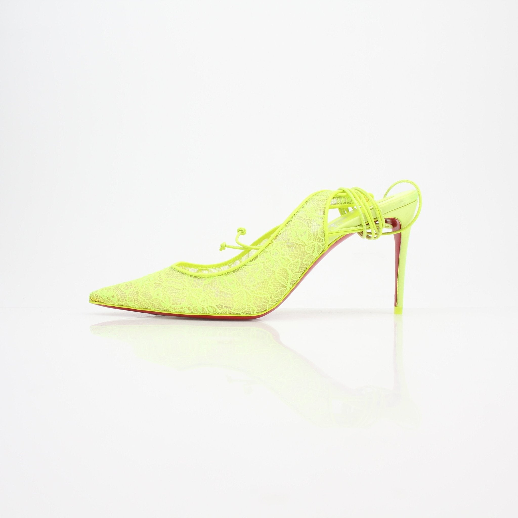 Gold & Beyond Christian Louboutin Lace Up Kate Slingback Heels with red soles, featuring sleek design and elegant lace-up style.