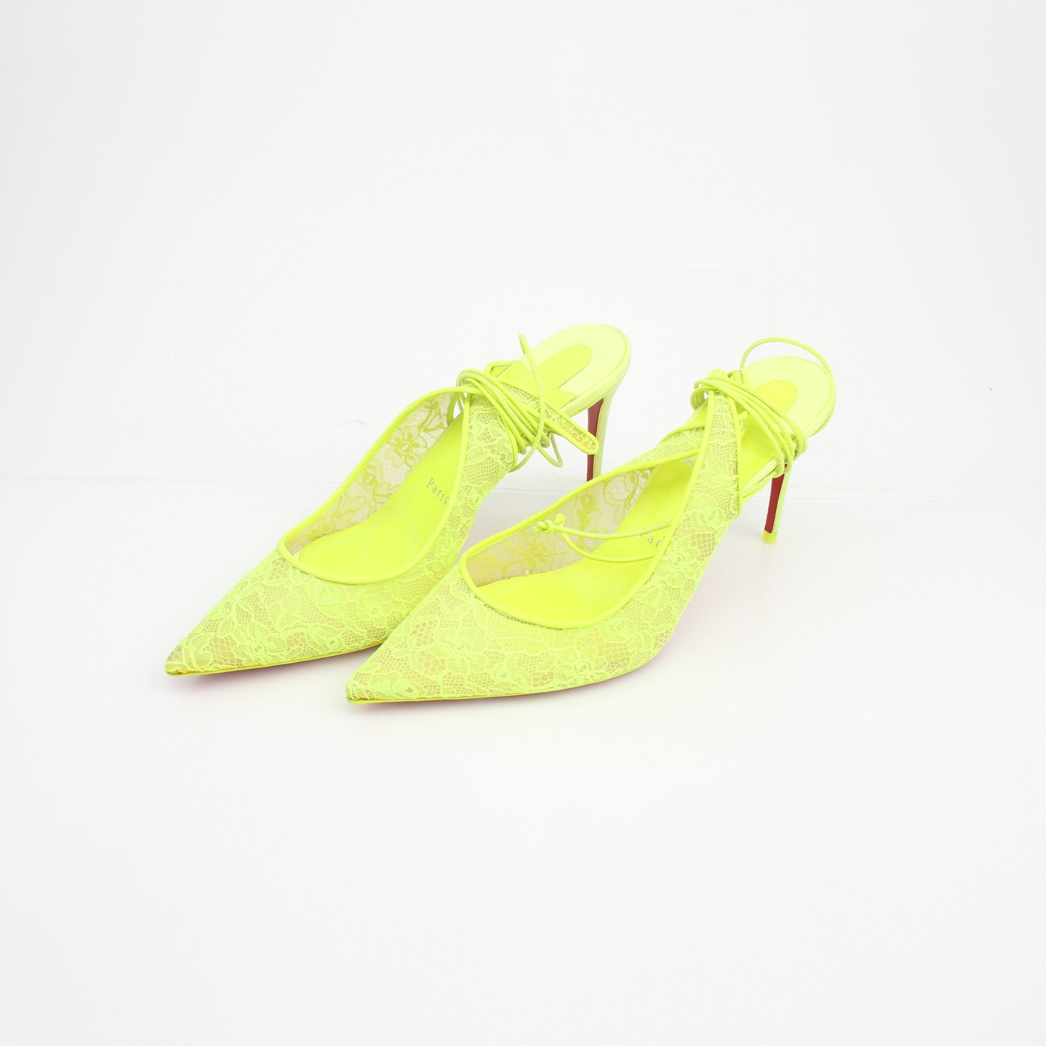Christian Louboutin Lace Up Kate Slingback Heels with red soles and elegant design, shown on a neutral background.