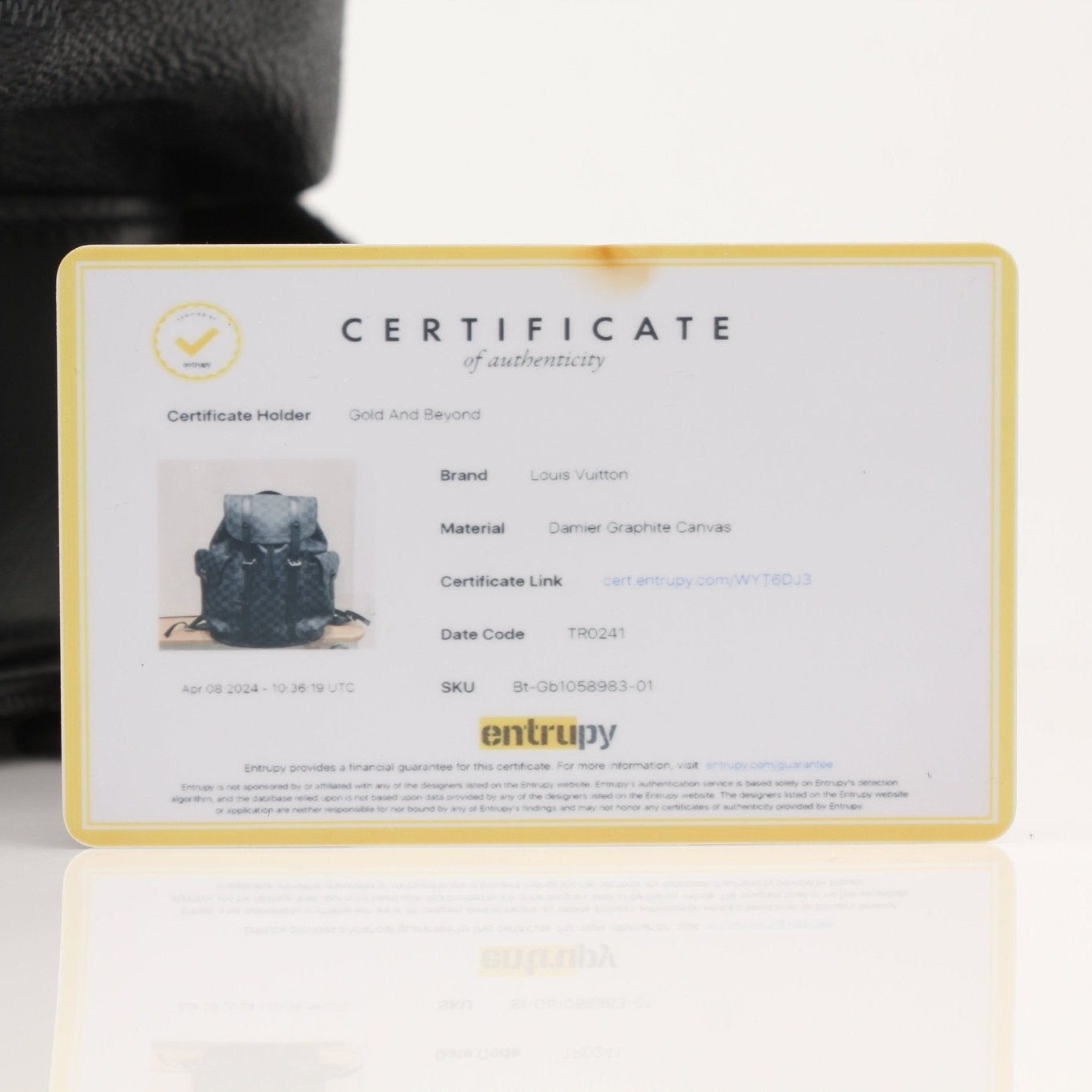 Louis Vuitton Christopher backpack in travel bag style, featuring dark leather with gold hardware and adjustable straps.