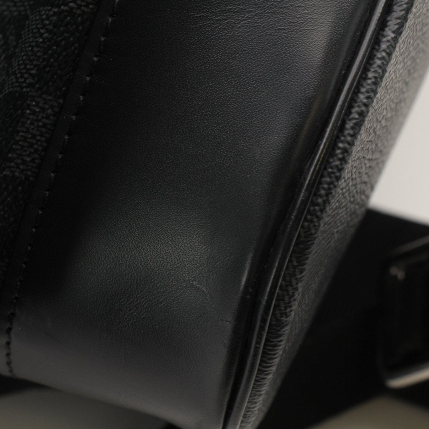 Gold &amp; Beyond Louis Vuitton Christopher backpack, stylish travel bag with leather details and spacious interior, displayed on a neutral background.