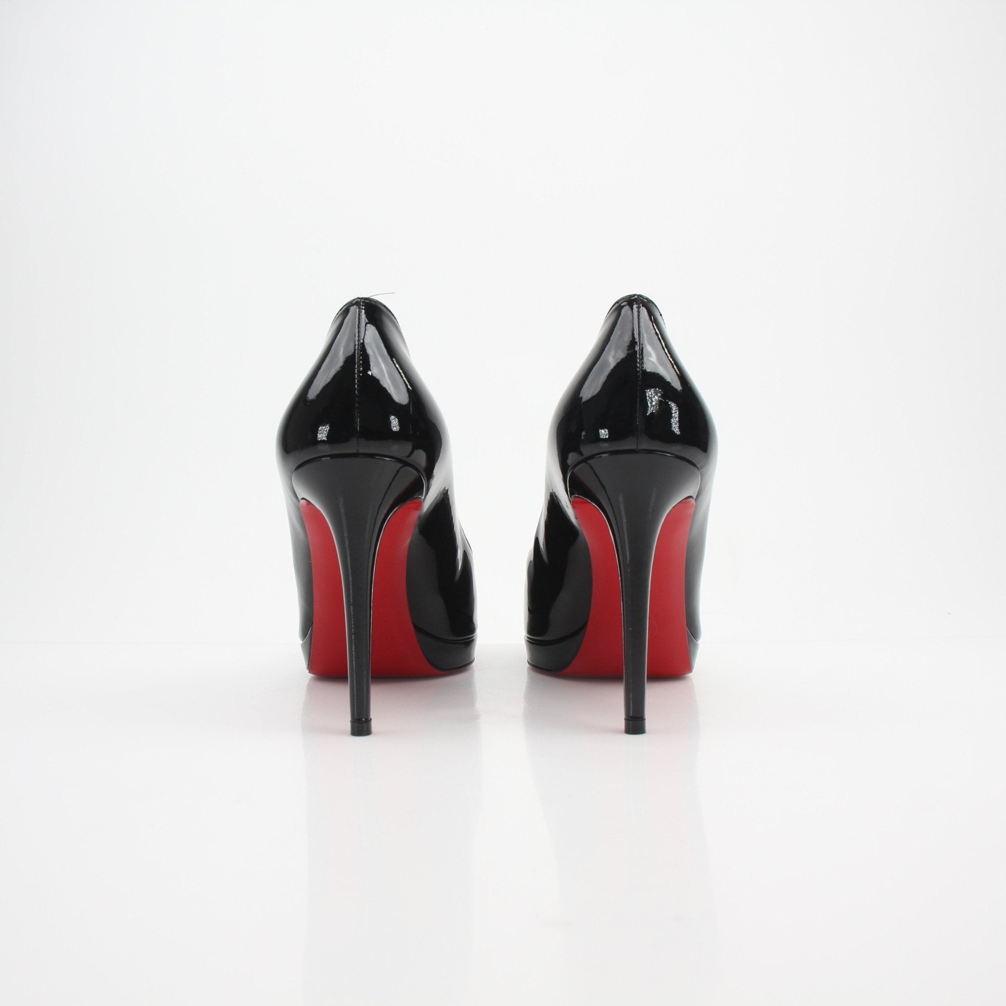 Gold & Beyond Christian Louboutin New Simple patent leather pumps, elegant high heels with a sleek finish and pointed toes.