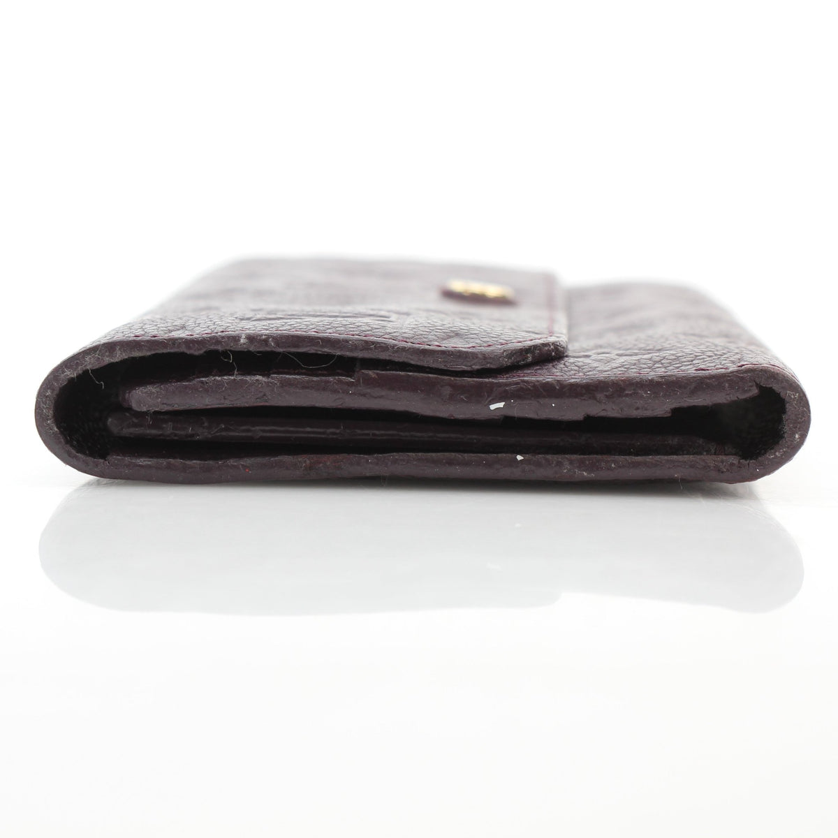Louis Vuitton Monogram Empreinte Marie-Lou wallet in burgundy leather, shown open with card slots and compartments