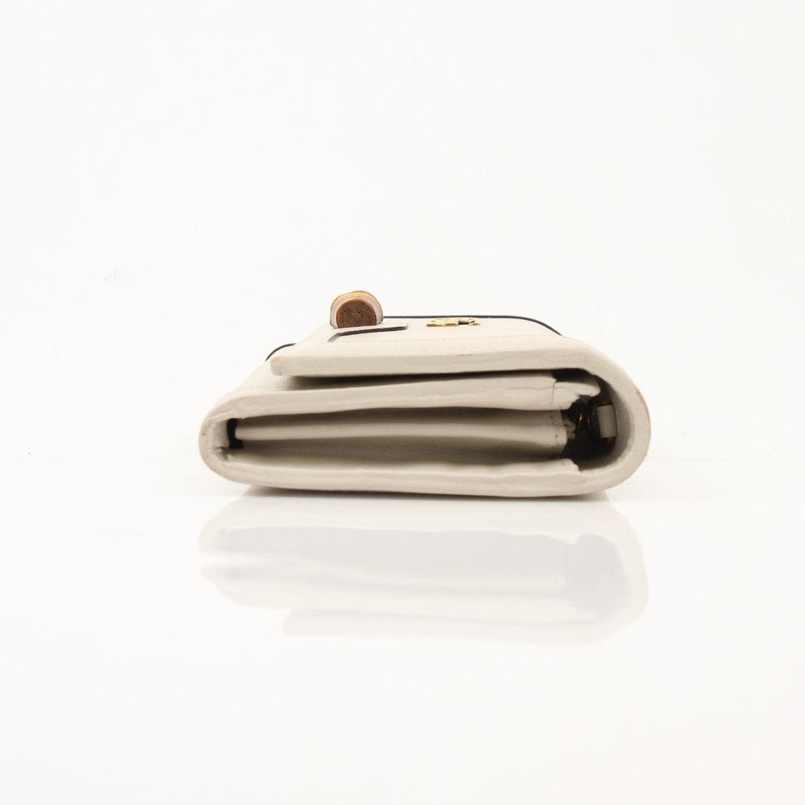 Gucci Diana wallet in gold and black leather with signature design, featuring multiple card slots and a sleek compact style.