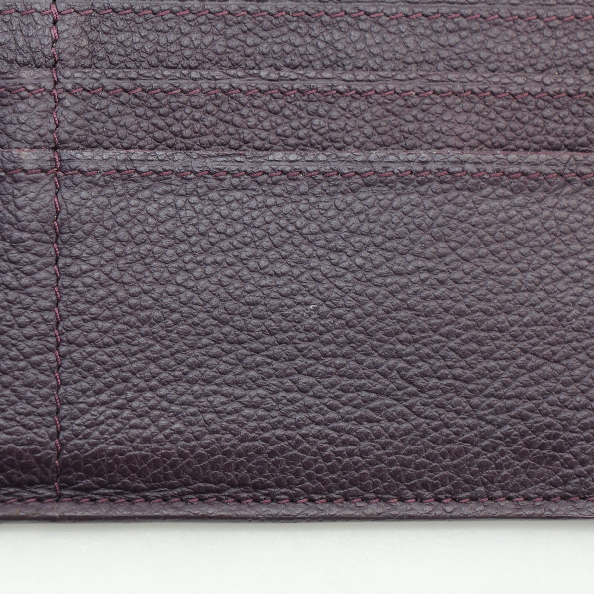 Louis Vuitton Monogram Empreinte Marie-Lou wallet in burgundy leather, front view with embossed monogram pattern