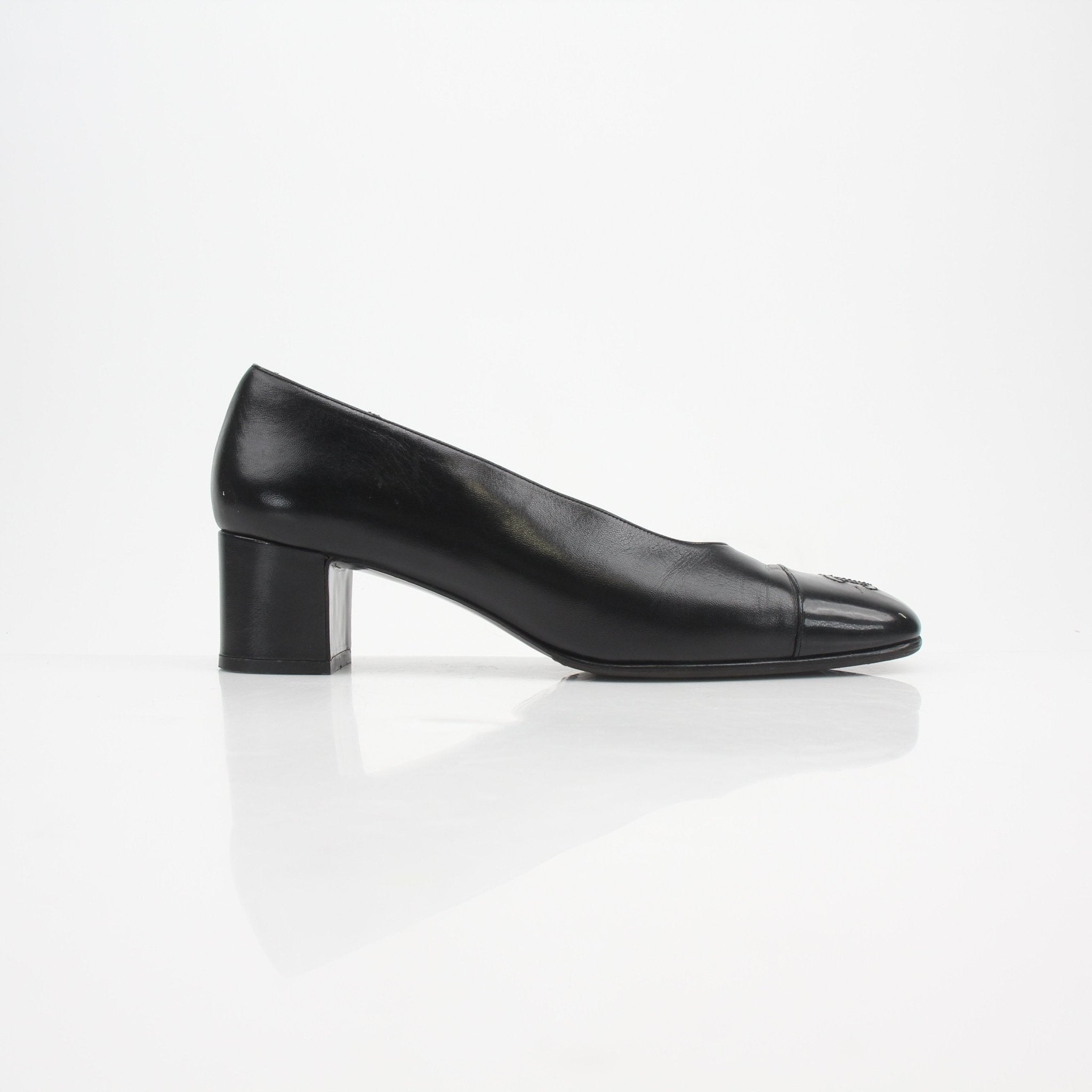 Gold & Beyond Chanel Cap Toe CC Block Heel Pumps, stylish women's shoes with black and beige cap toe design, elegant and comfortable.
