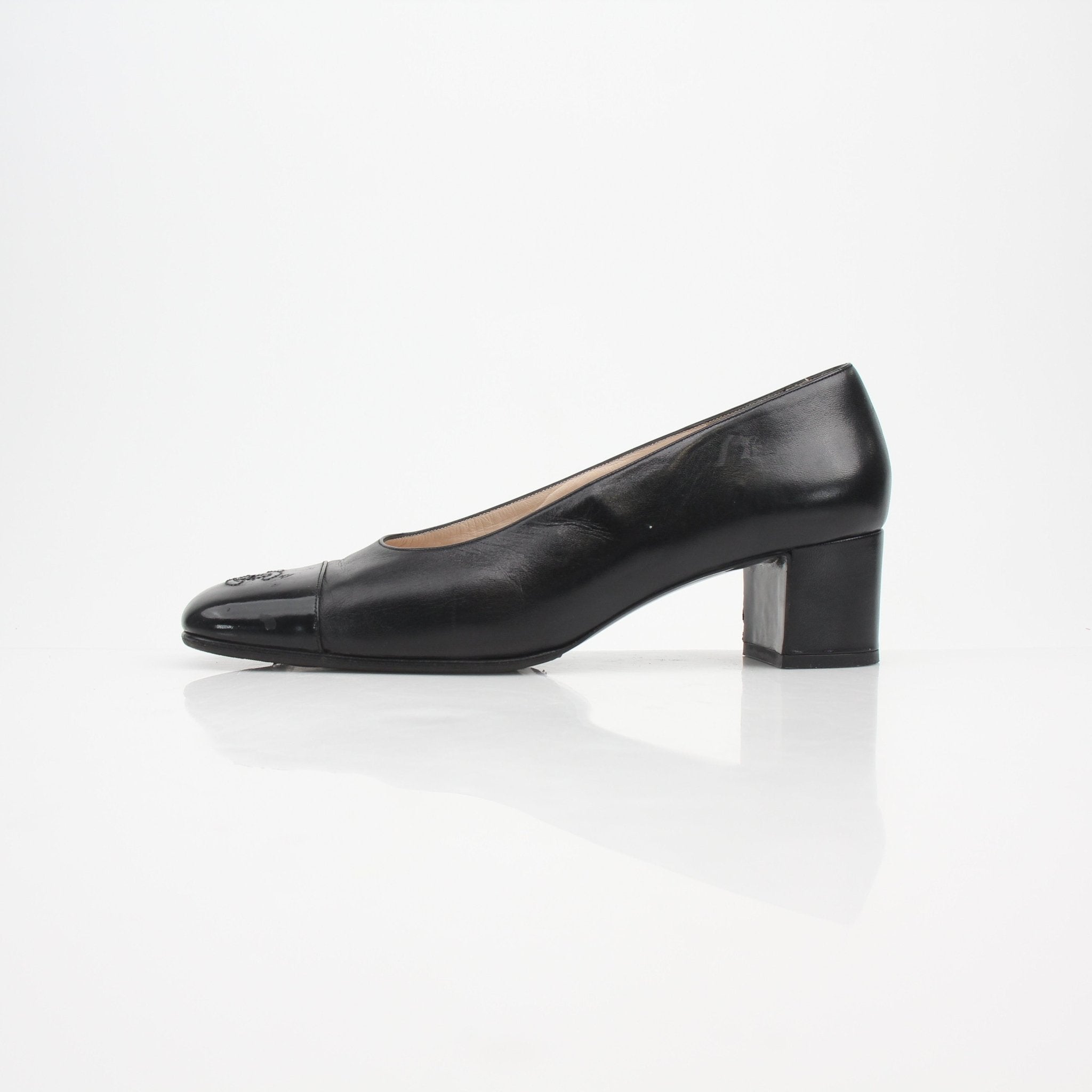 Gold & Beyond Chanel Cap Toe CC Block Heel Pumps, elegant black shoes with signature CC detail and sturdy block heel.