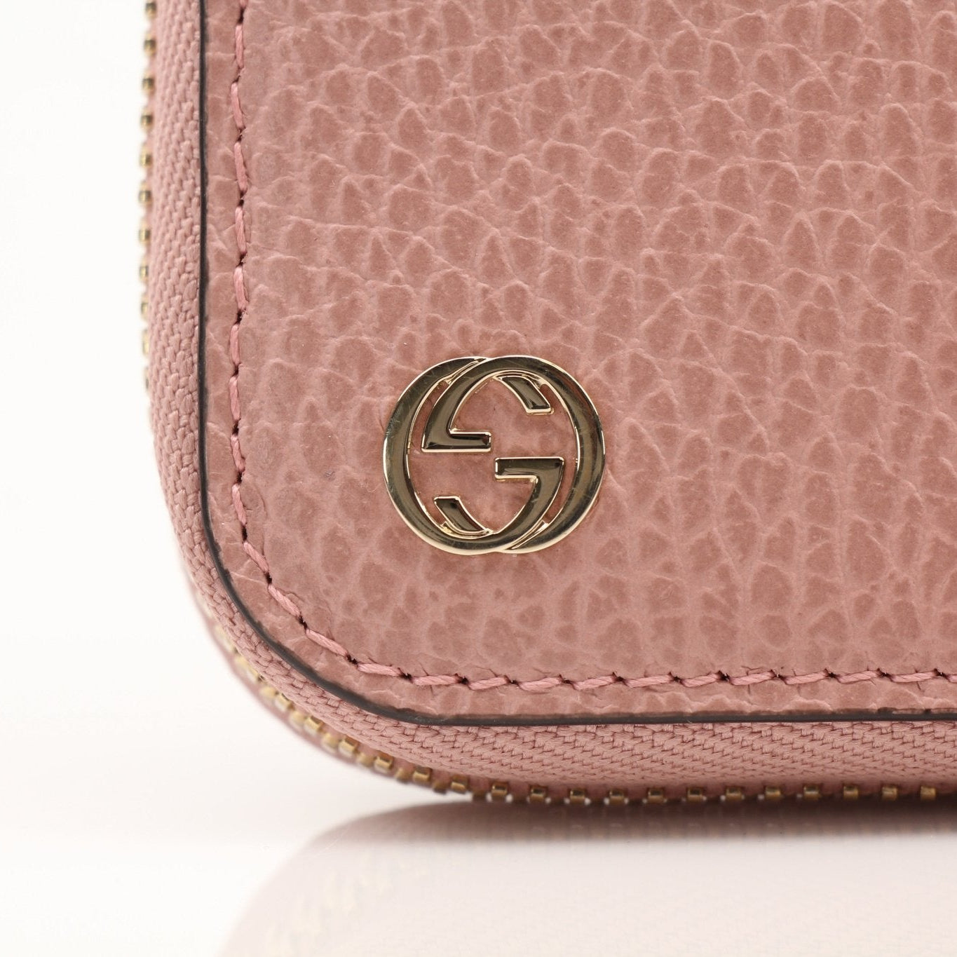 Gucci GG Logo Zip Continental Wallet featuring gold accents and signature monogram design, made by Gold & Beyond.