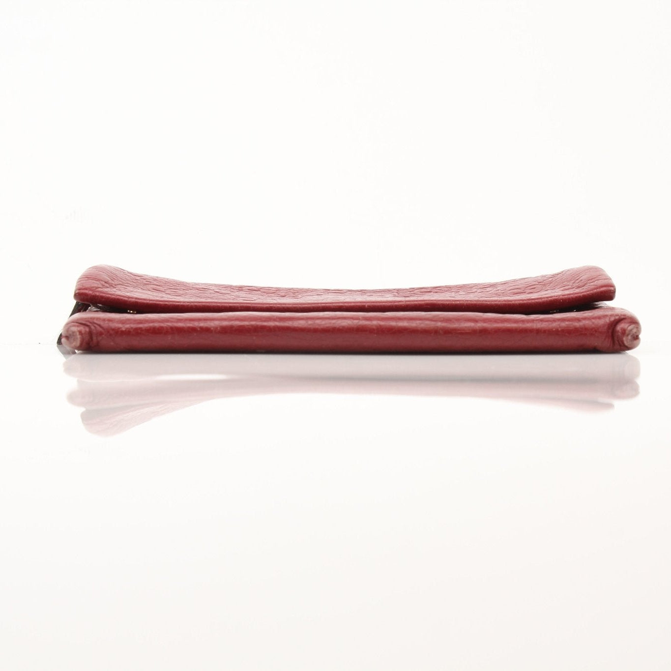 Gold & Beyond Gucci Guccissima continental wallet with embossed leather, gold-toned hardware, and multiple card slots.