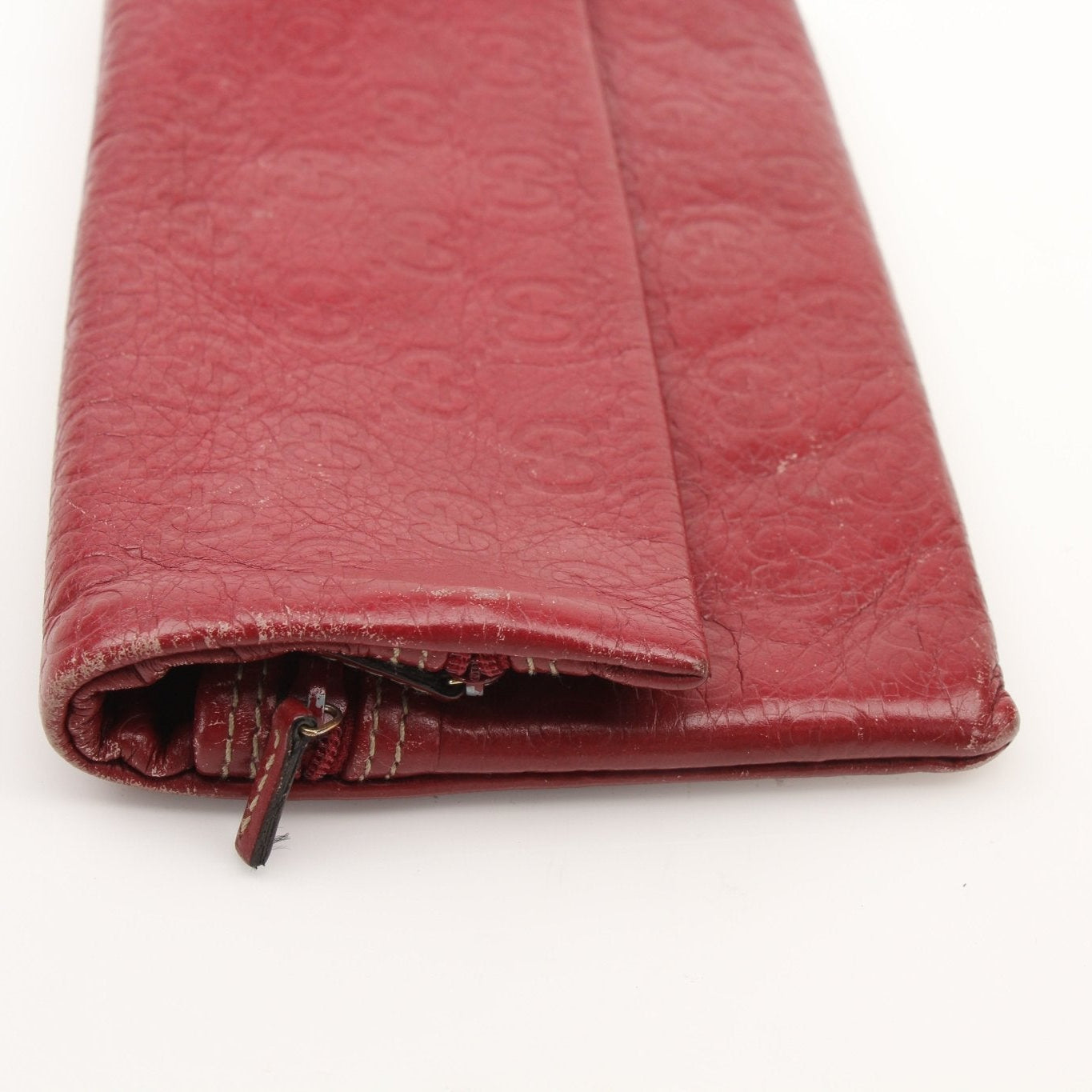 Gucci Guccissima Continental wallet by Gold & Beyond showing textured leather with gold accents and multiple card slots.