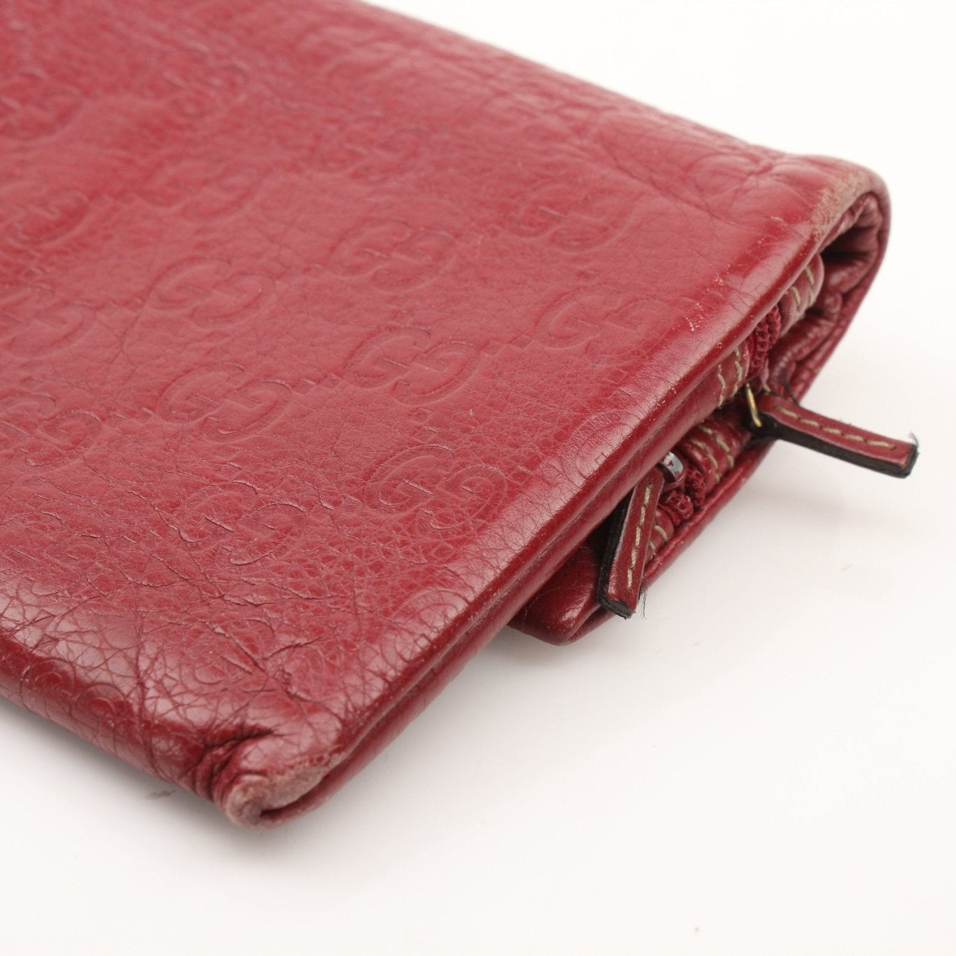 Gucci Guccissima Continental wallet in brown leather with gold-tone hardware and signature embossed pattern.