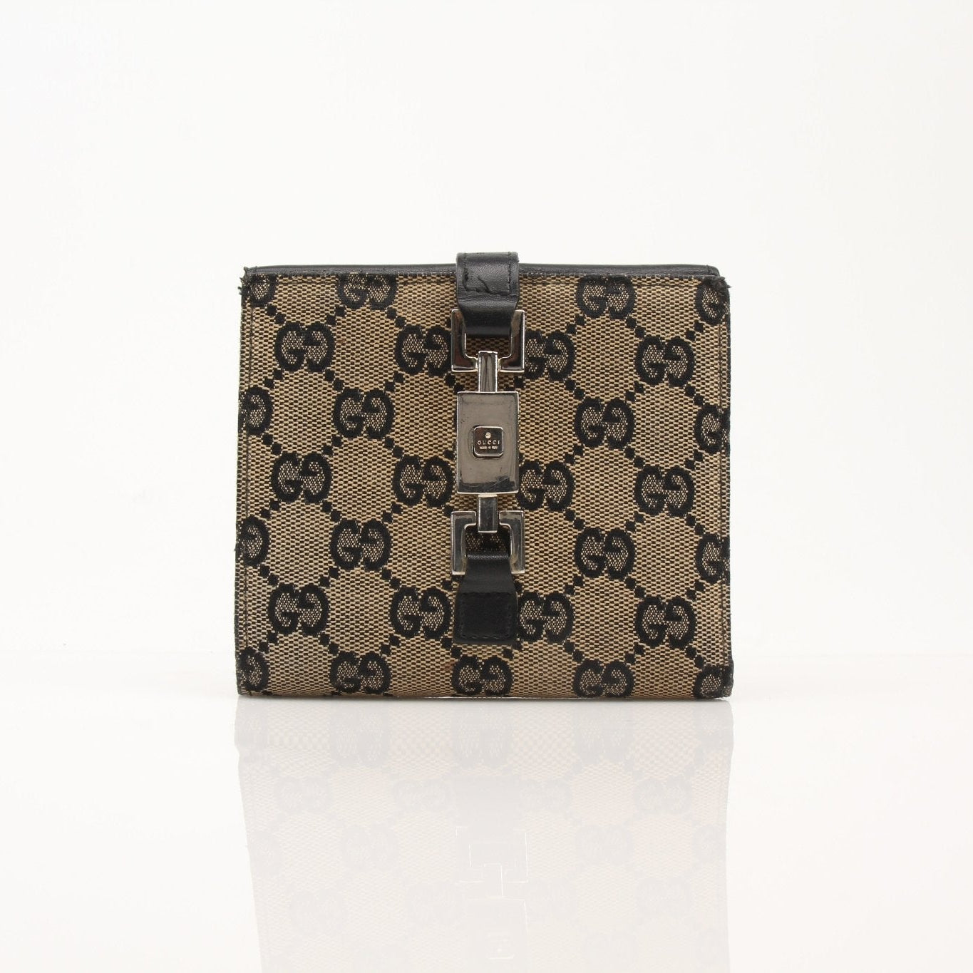 Vintage Gucci Jackie GG wallet by Gold & Beyond, featuring classic logo pattern, leather accents, and compact design.