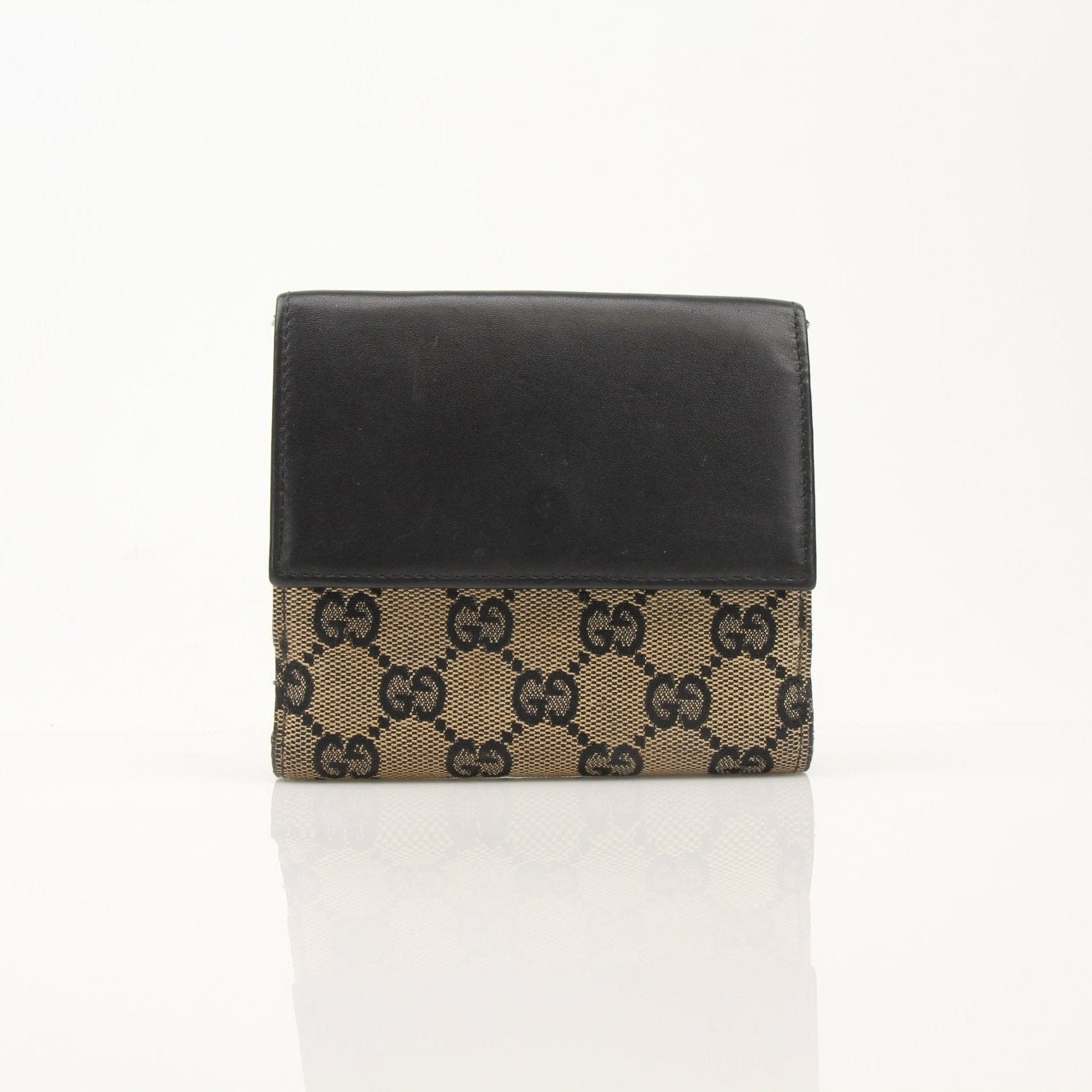 Vintage Gucci Jackie GG wallet by Gold & Beyond, featuring classic design with gold accents and signature monogram pattern.