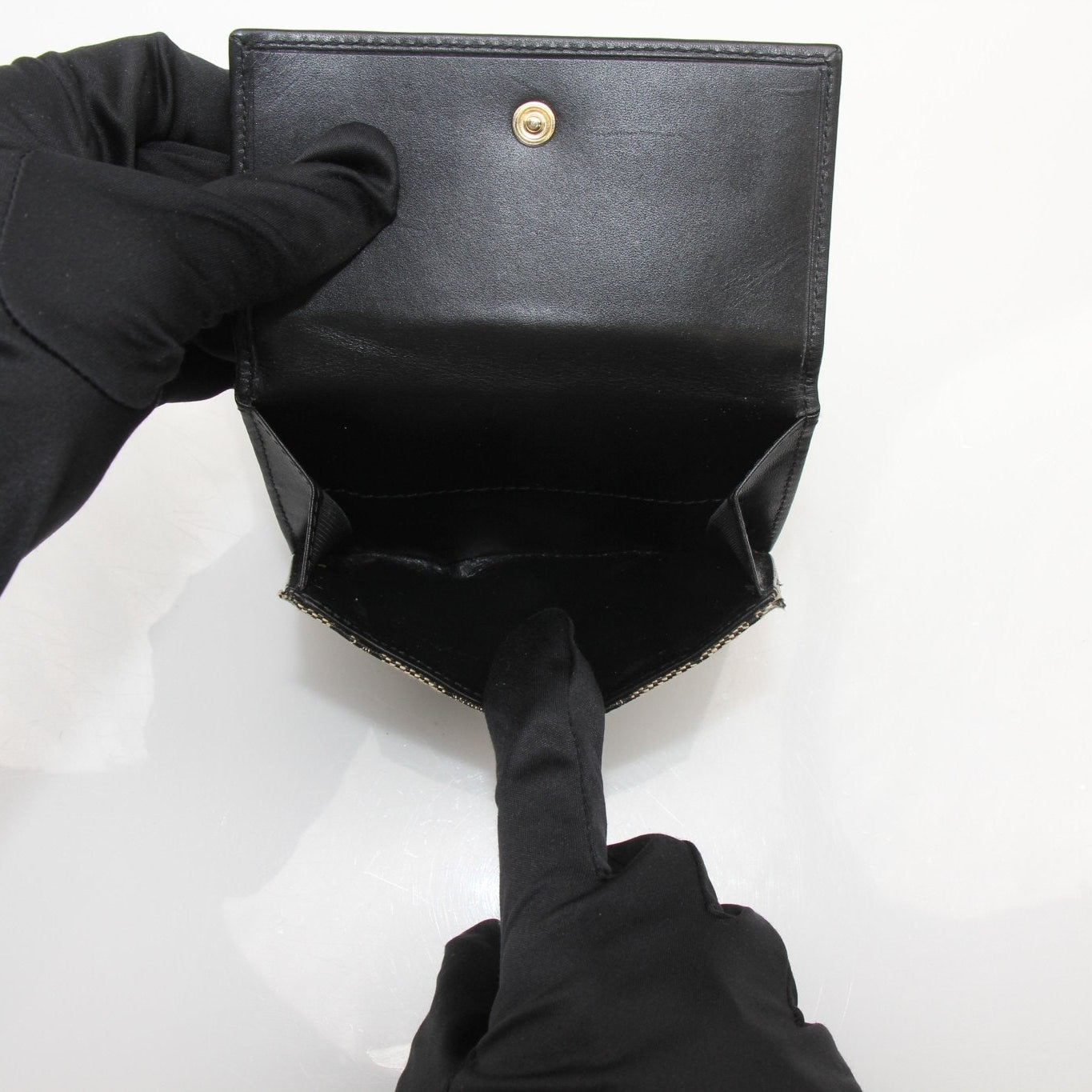 Vintage Gucci Jackie GG wallet by Gold & Beyond, featuring a classic leather design with gold hardware and iconic GG pattern.