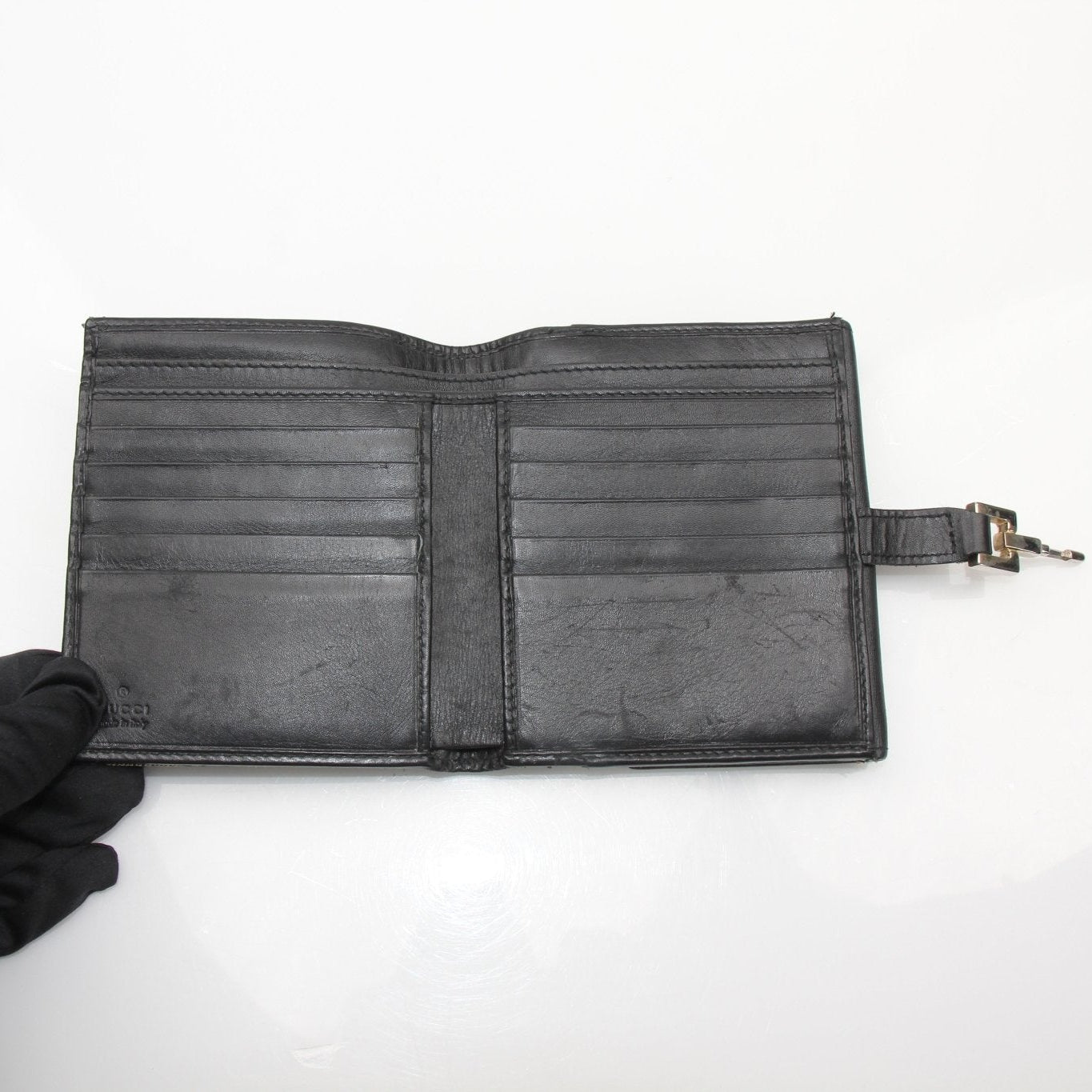 Vintage Gucci Jackie GG Wallet from Gold & Beyond, featuring classic monogram canvas and leather accents.