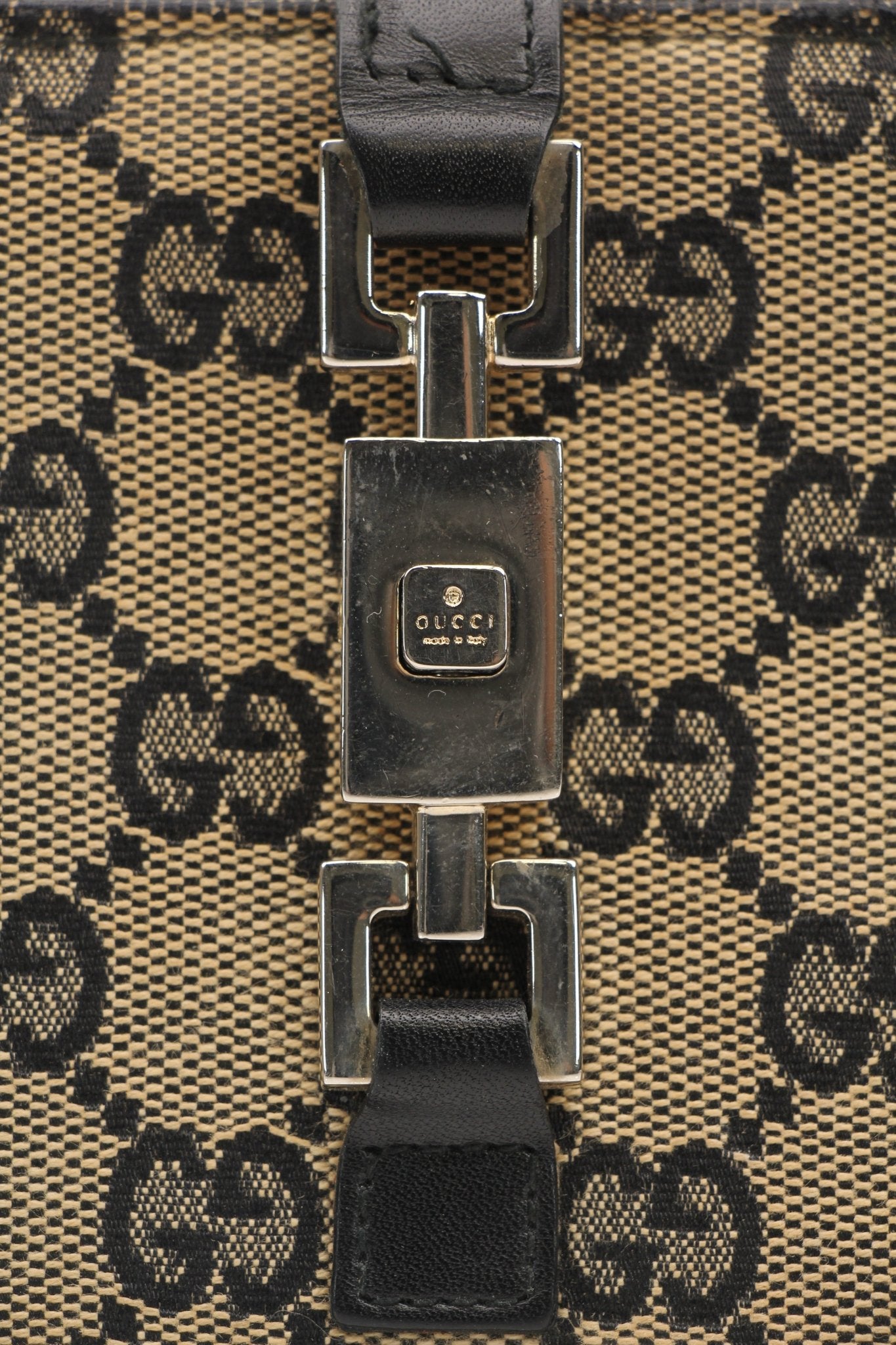 Vintage Gucci Jackie GG wallet by Gold & Beyond showing classic monogram canvas, leather trim, and gold-tone accents.