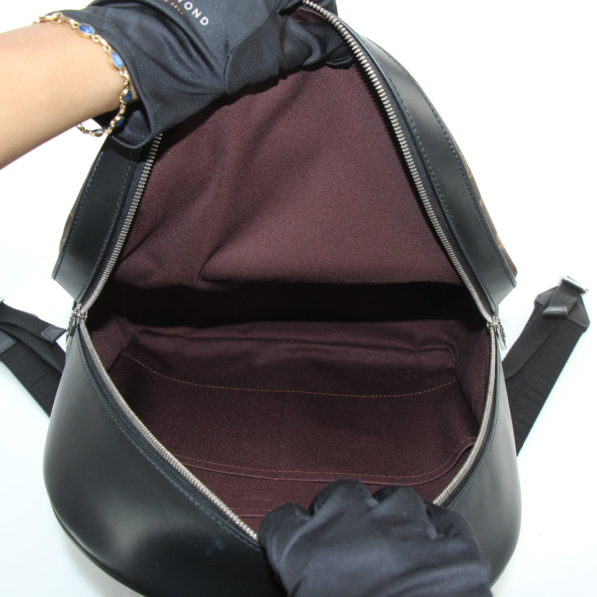Louis Vuitton Monogram Canvas Josh backpack in brown with adjustable shoulder straps and front pocket