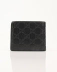 Gold & Beyond Gucci Guccissima bi-fold wallet with embossed leather, featuring multiple card slots and classic design.