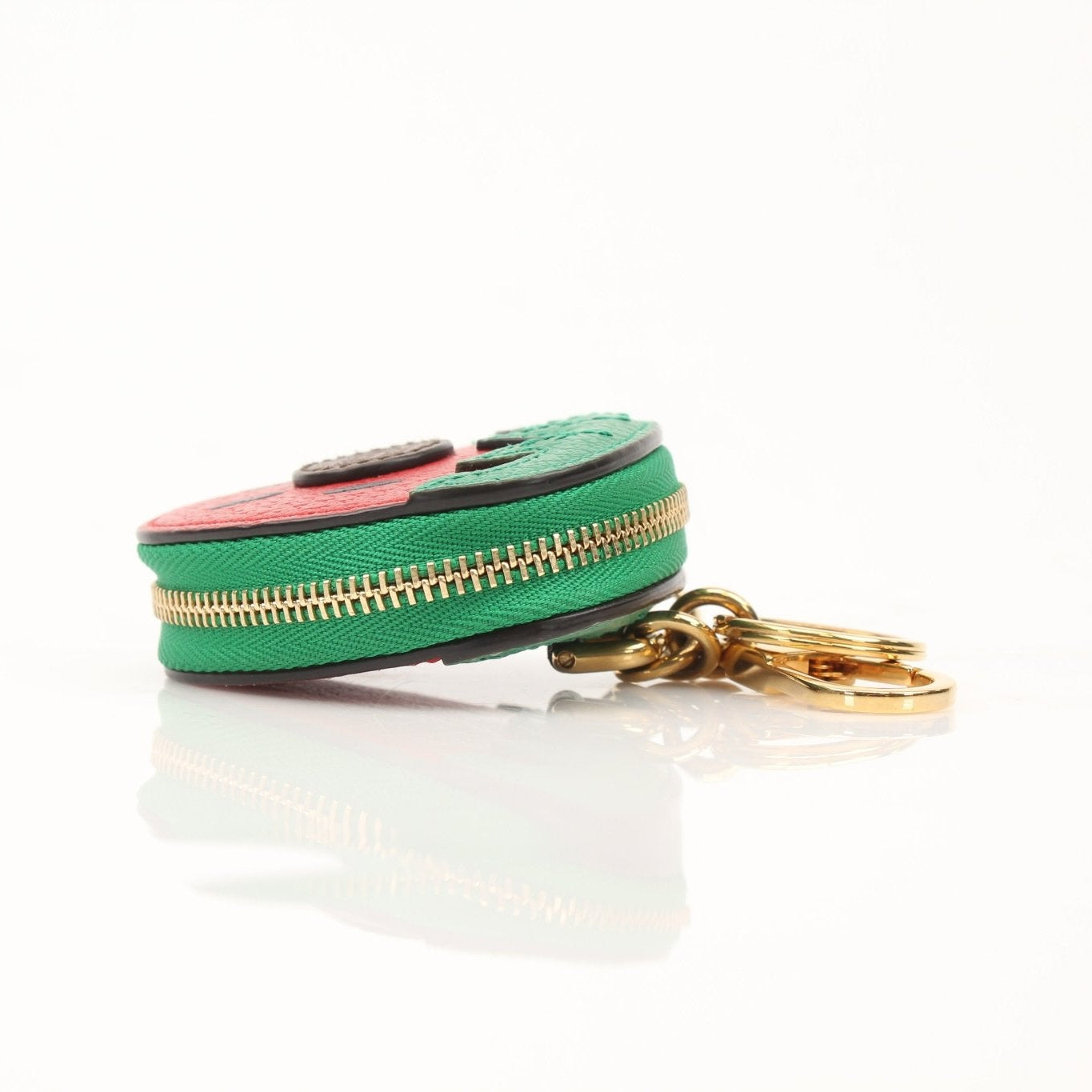 Gold & Beyond Gucci Fruitini Zip Coin Pouch wallet with colorful fruit print and gold zipper closure on a white background.