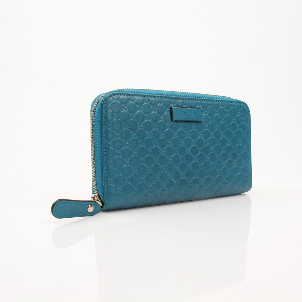 Gucci Micro Guccissima wallet by Gold & Beyond showing textured leather with gold-tone logo accents.