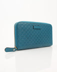 Gucci Micro Guccissima wallet by Gold & Beyond showing textured leather with gold-tone logo accents.