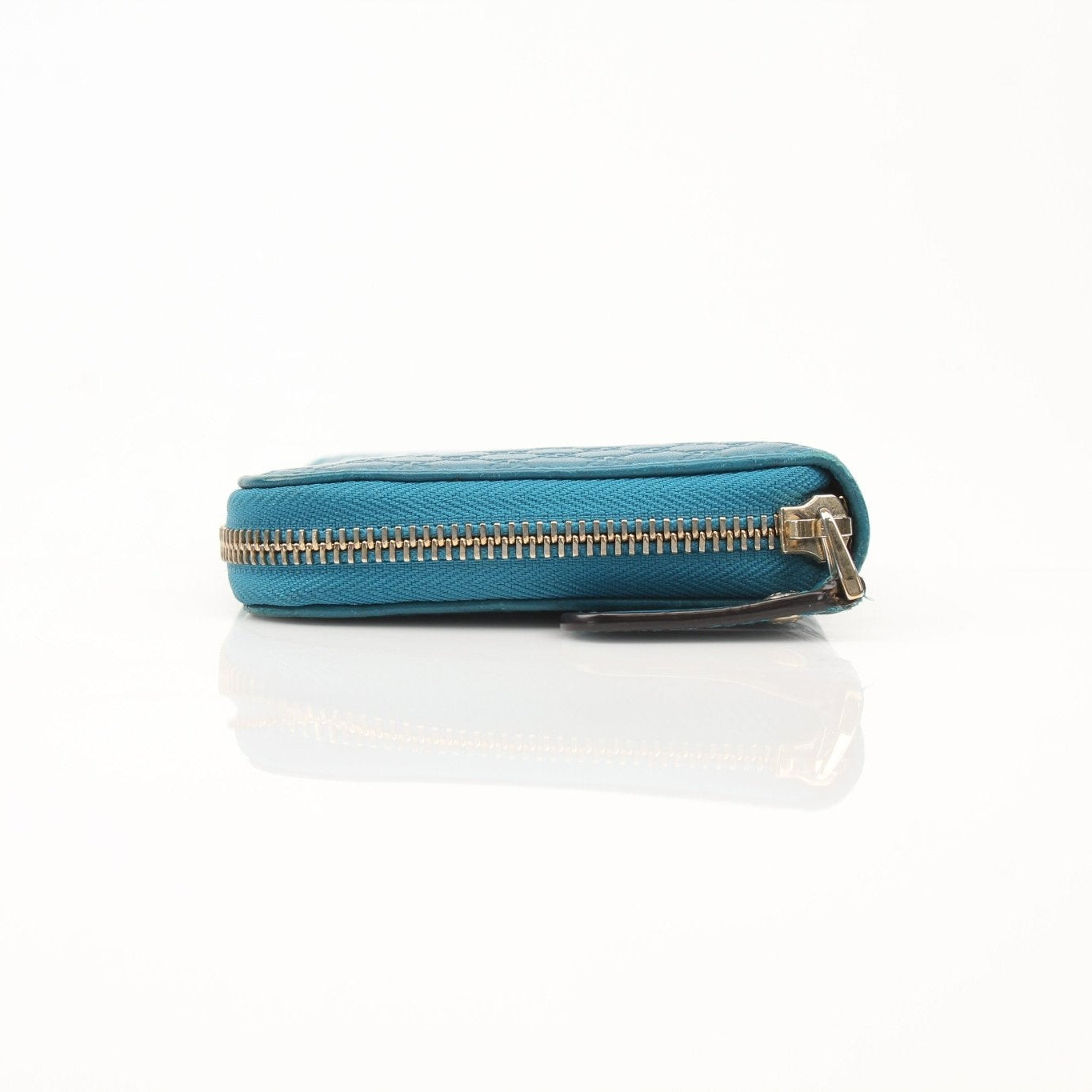 Gold & Beyond Gucci MicroGuccissima Wallet with textured leather exterior and compact design, perfect for everyday use.