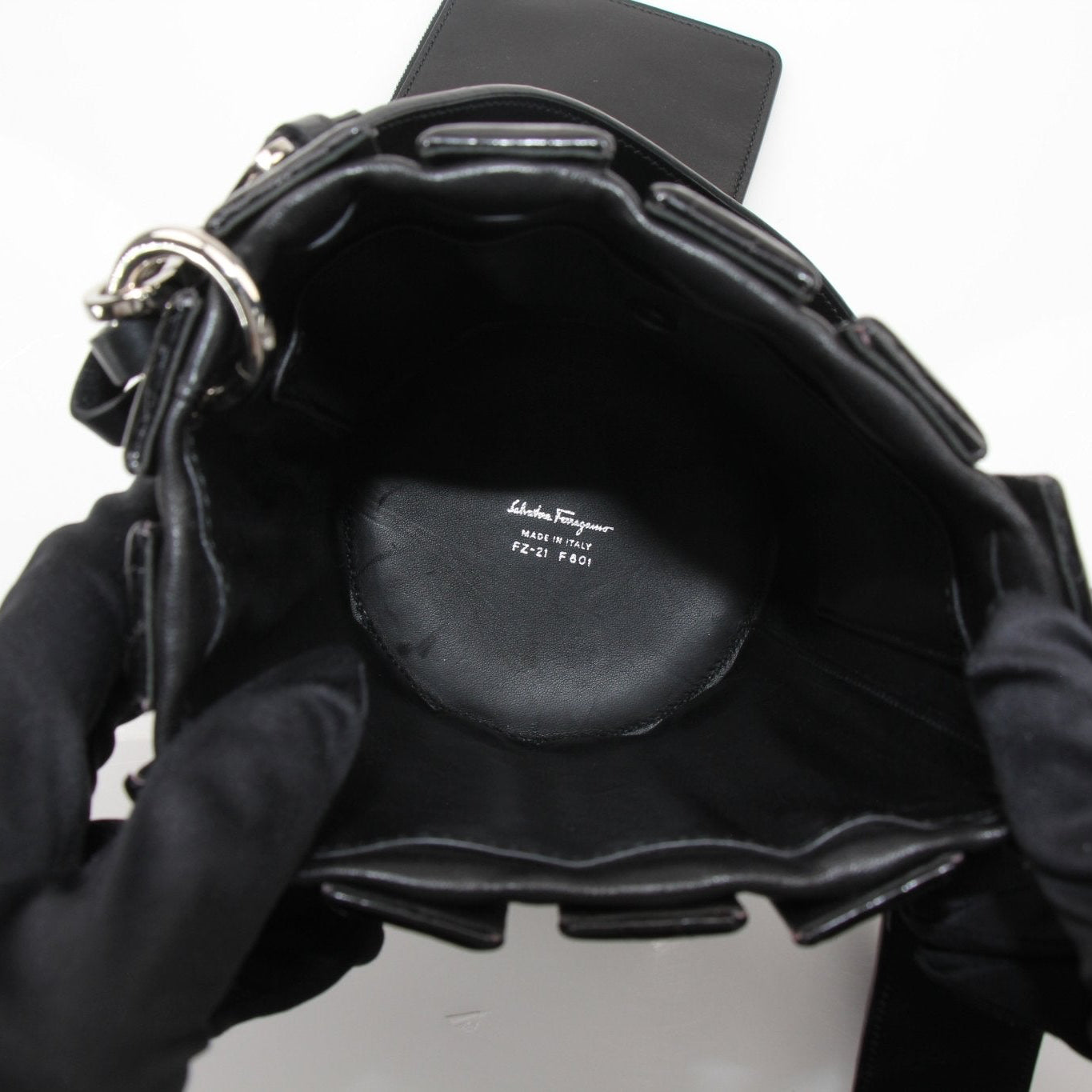 Salvatore Ferragamo stone crocodile bucket handbag featuring textured leather and a stylish, structured design.