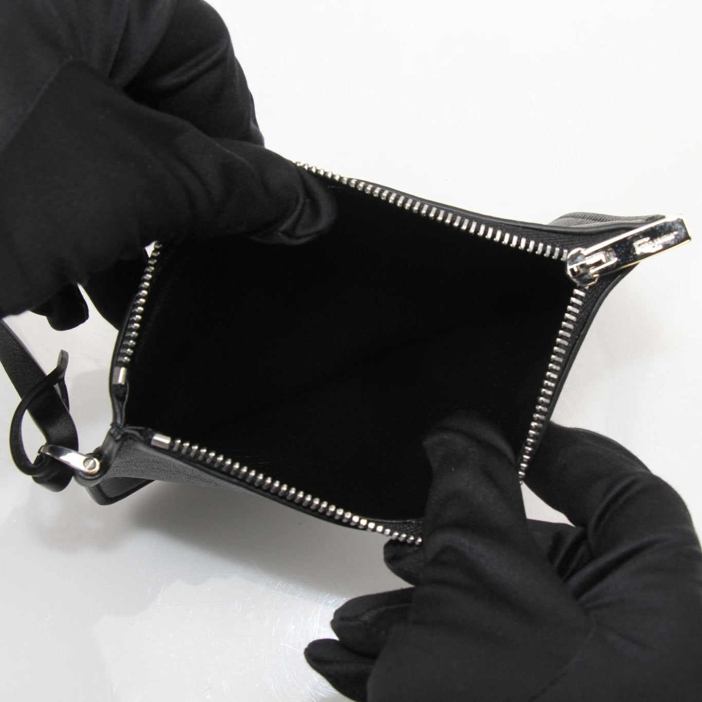 Salvatore Ferragamo stone crocodile bucket handbag with textured leather and a stylish silhouette.