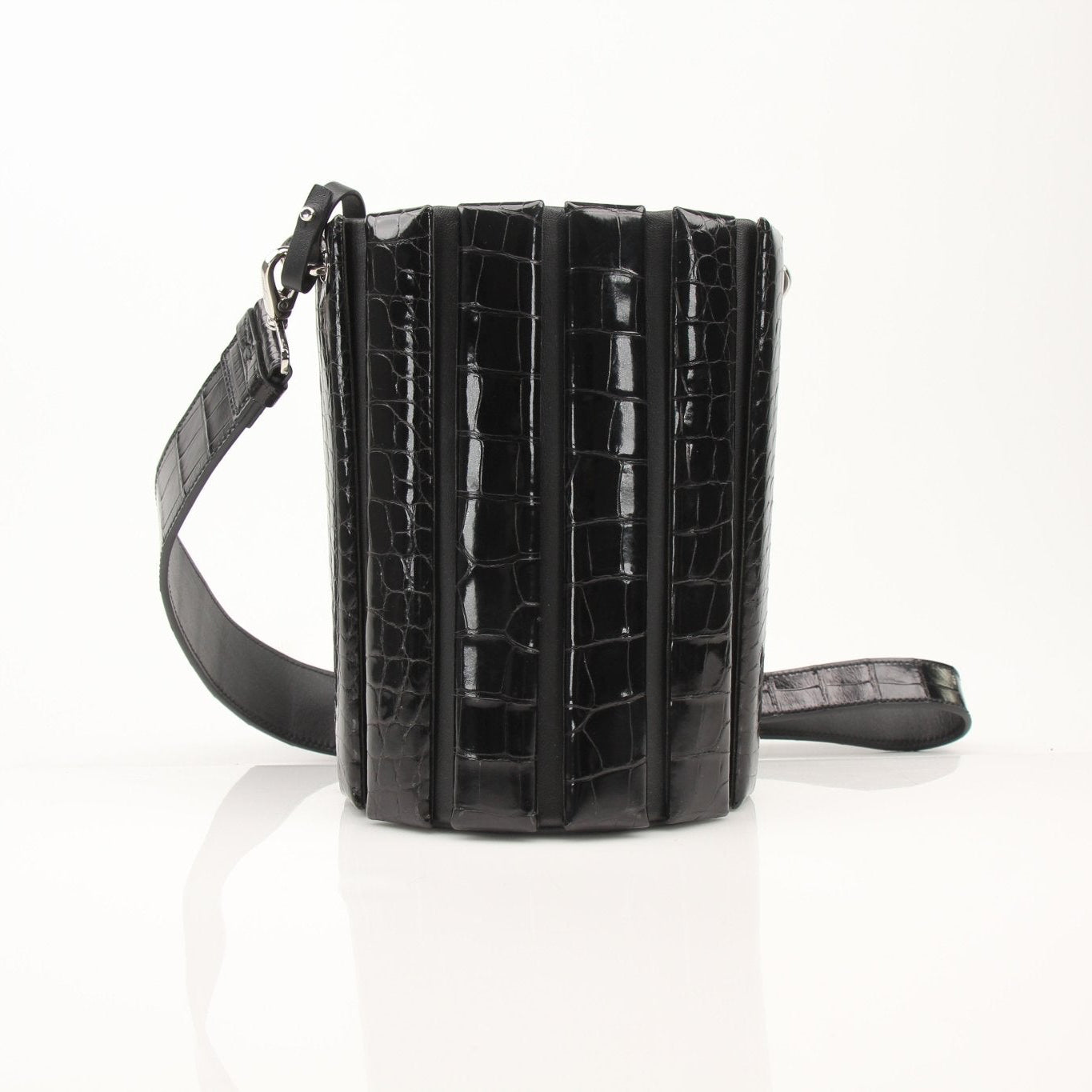 Salvatore Ferragamo stone crocodile bucket handbag with textured leather and elegant design.