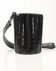 Salvatore Ferragamo stone crocodile bucket handbag with textured leather and elegant design.