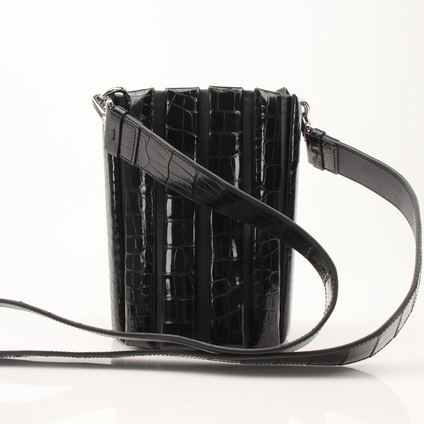 Salvatore Ferragamo stone crocodile bucket handbag featuring a textured design and elegant silhouette.