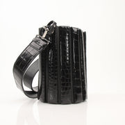 Salvatore Ferragamo stone crocodile bucket handbag with textured leather and a stylish silhouette.