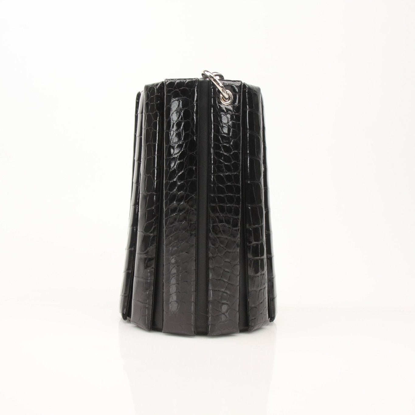Salvatore Ferragamo crocodile bucket handbag in stone color, featuring a textured exterior and stylish silhouette.