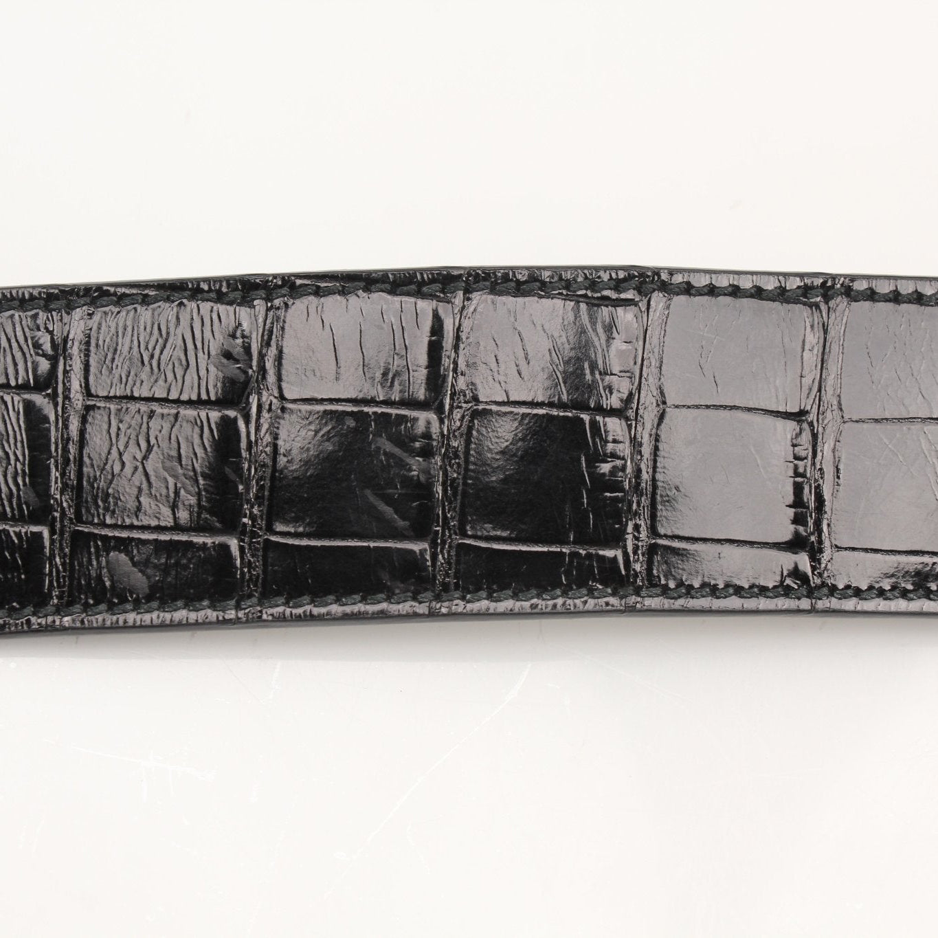 Salvatore Ferragamo stone crocodile bucket handbag with textured exterior and elegant design.