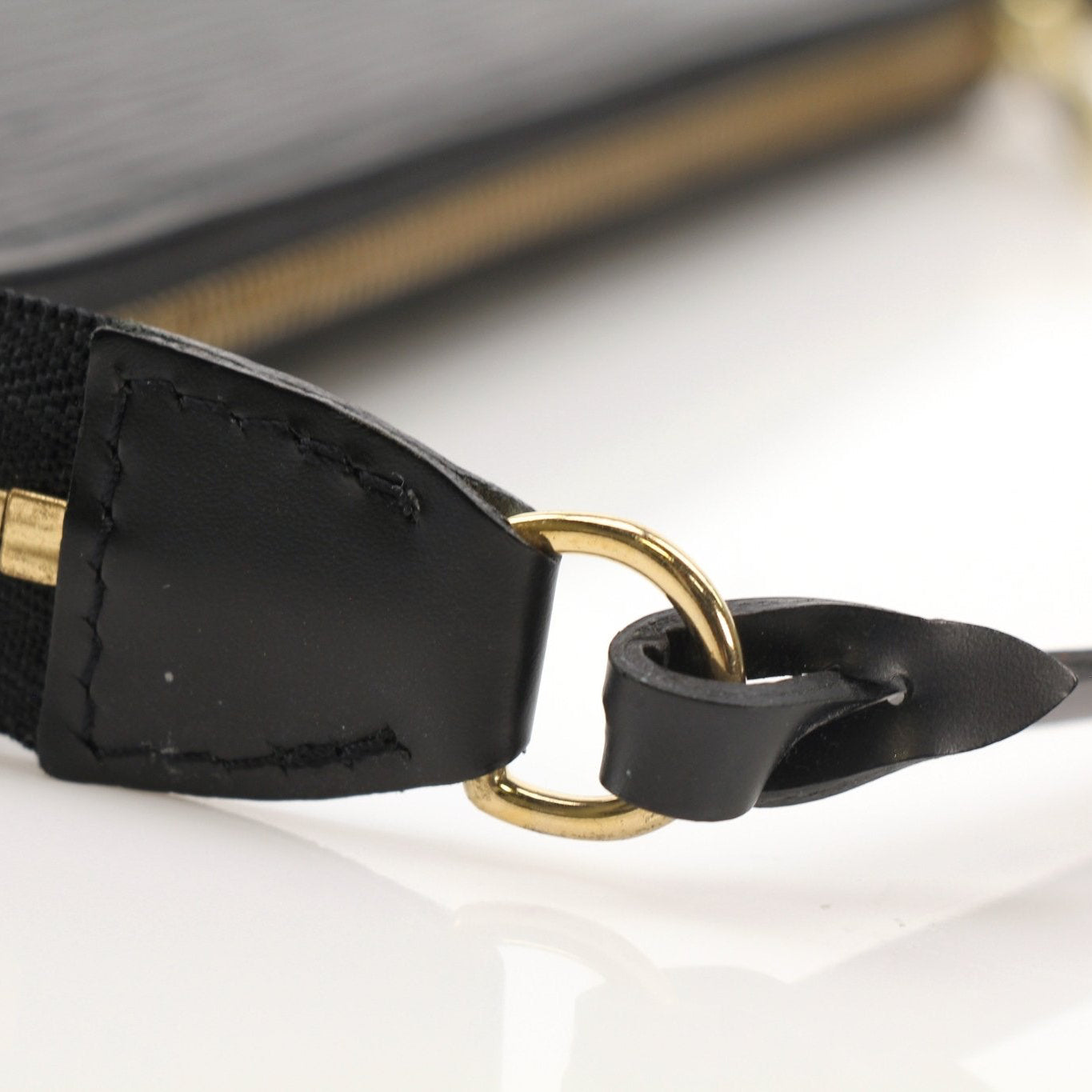 Louis Vuitton Pochette handbag by Gold & Beyond, featuring a stylish design with a gold chain strap and signature LV logo.