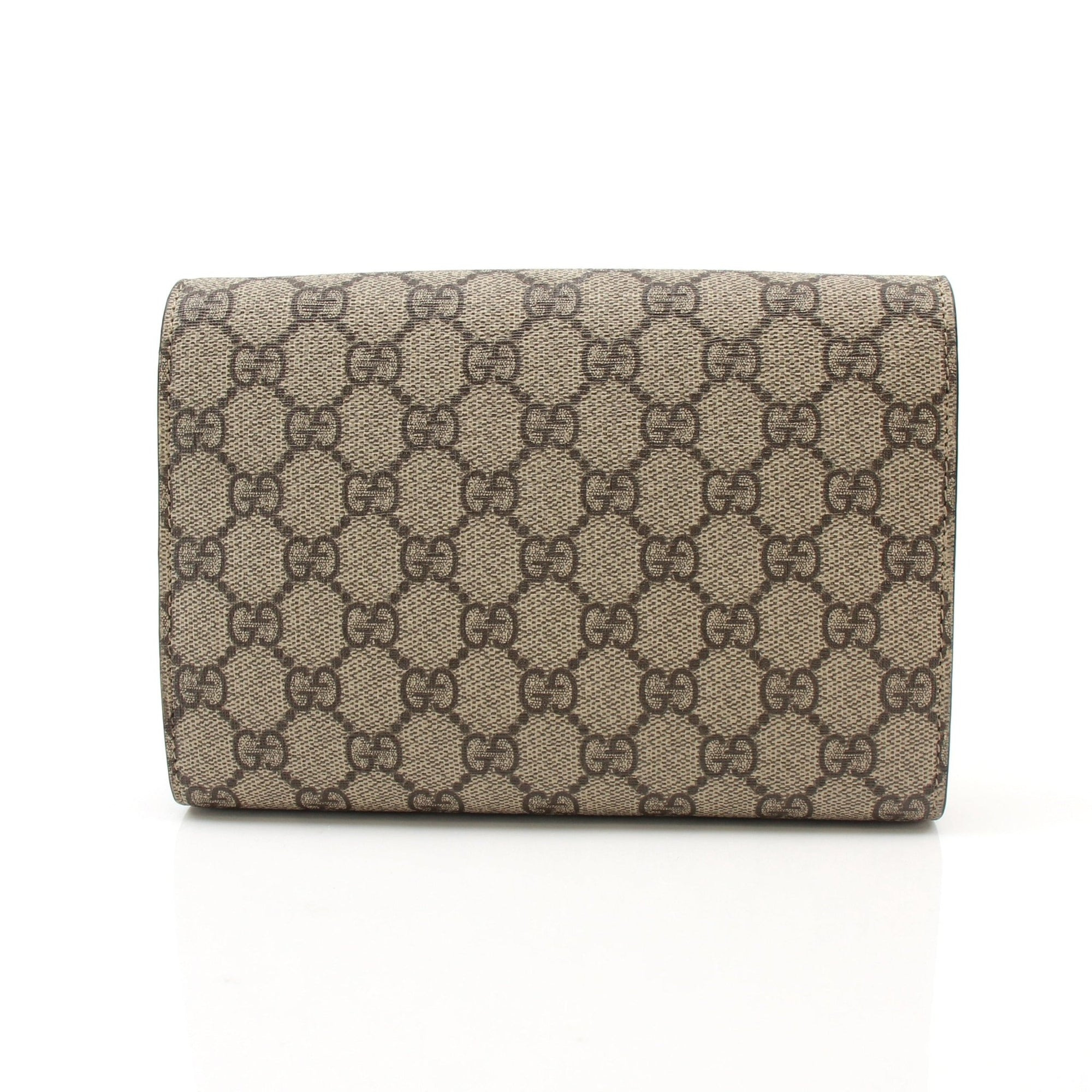 Gold & Beyond Gucci Dionysus GG Supreme Mini handbag with gold hardware and leather strap, stylish and compact accessory.