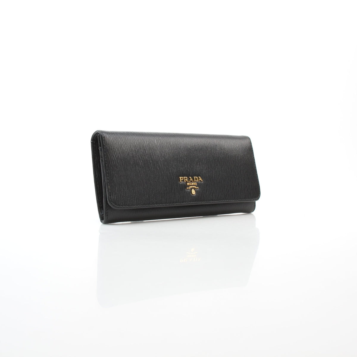 Prada black Vitello Move leather flap wallet by Gold & Beyond, front view with compact flap closure
