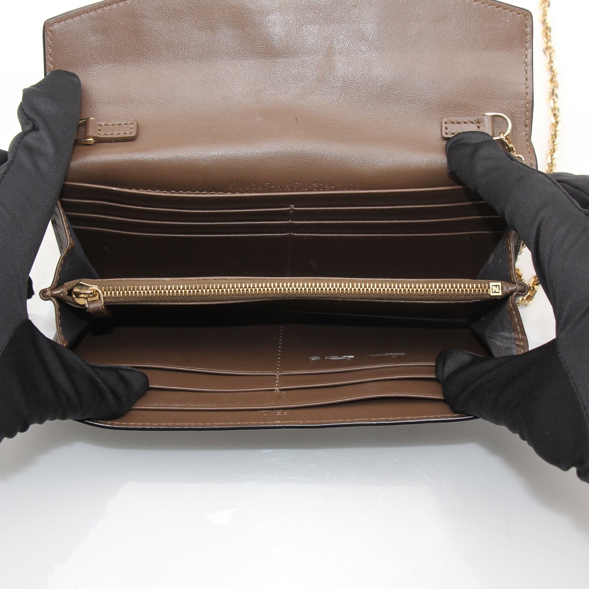 Gold & Beyond Fendi Wallet on Chain, elegant leather wallet with chain strap, featuring classic Fendi branding and gold-tone hardware.