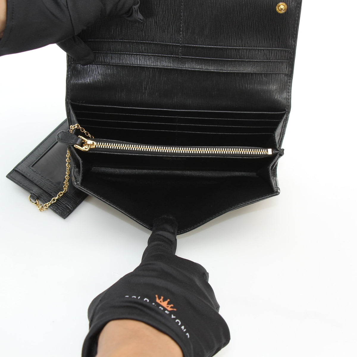 Prada black Vitello Move leather flap wallet with compact rectangular design and front flap closure