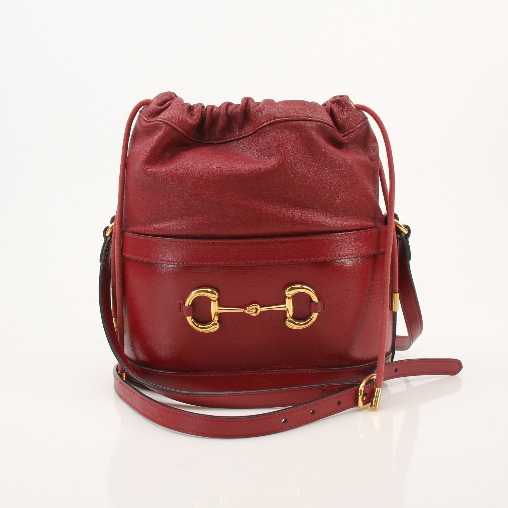 Gold & Beyond Gucci 1955 Horsebit Bucket Bag handbag with gold hardware and signature design, shown in a stylish angle.