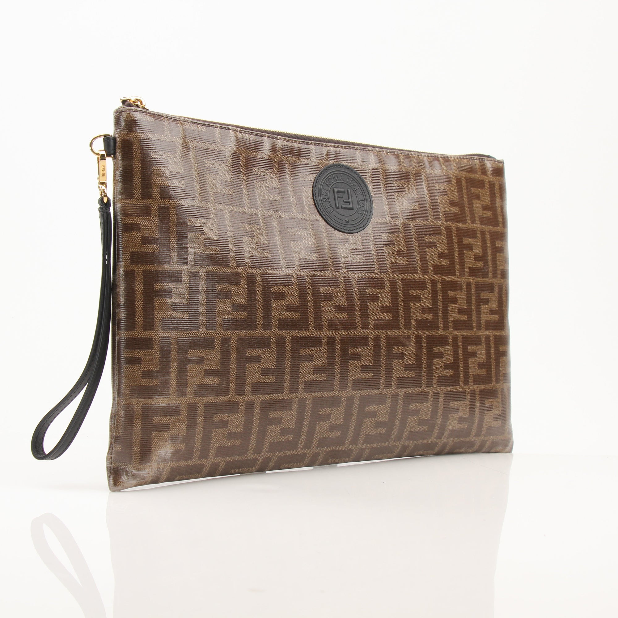 Gold & Beyond Fendi Zucca wristlet showing classic monogram pattern, leather trim, and compact design for carrying essentials.