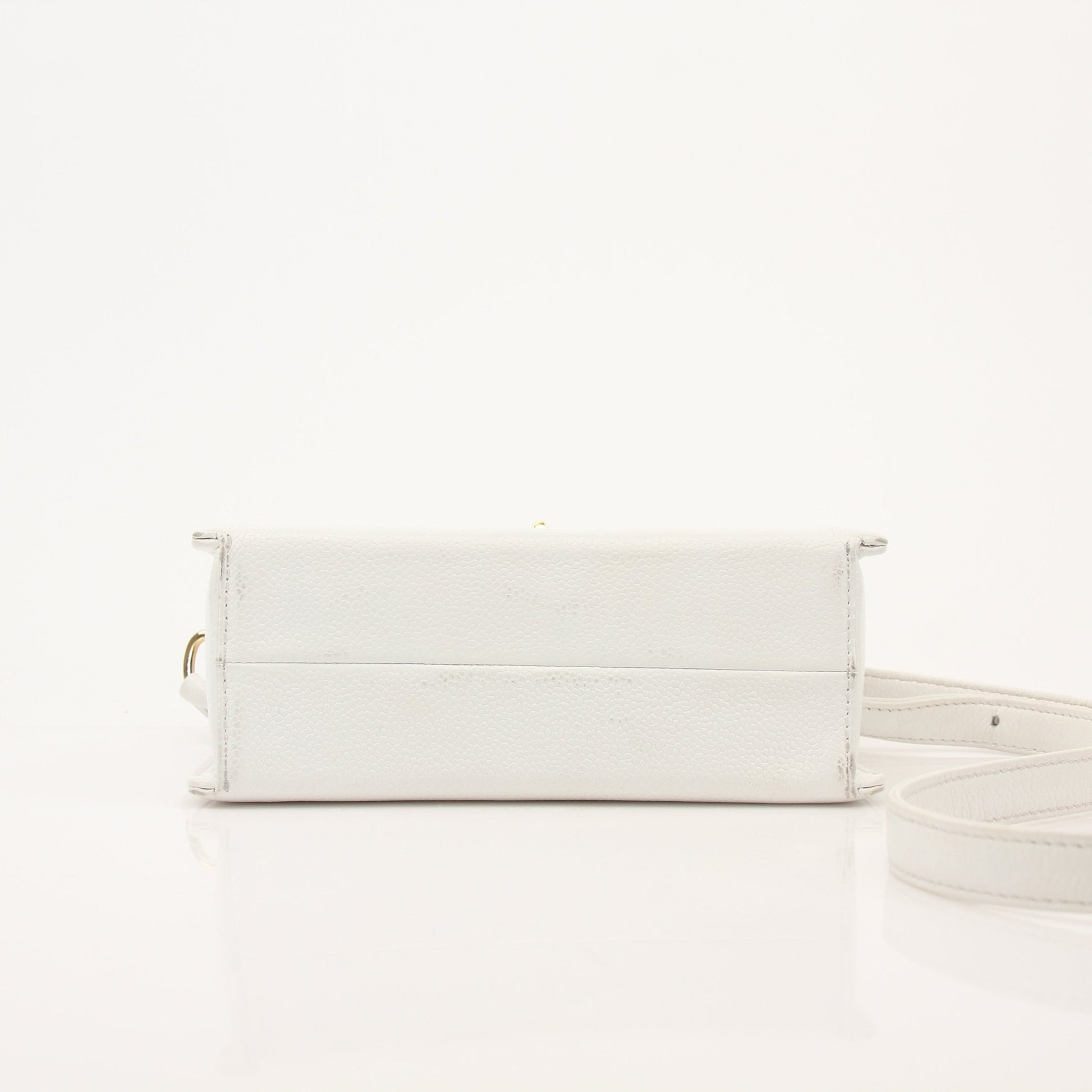 Chanel white caviar leather crossbody handbag with gold chain strap and quilted design, stylish and elegant for everyday use.