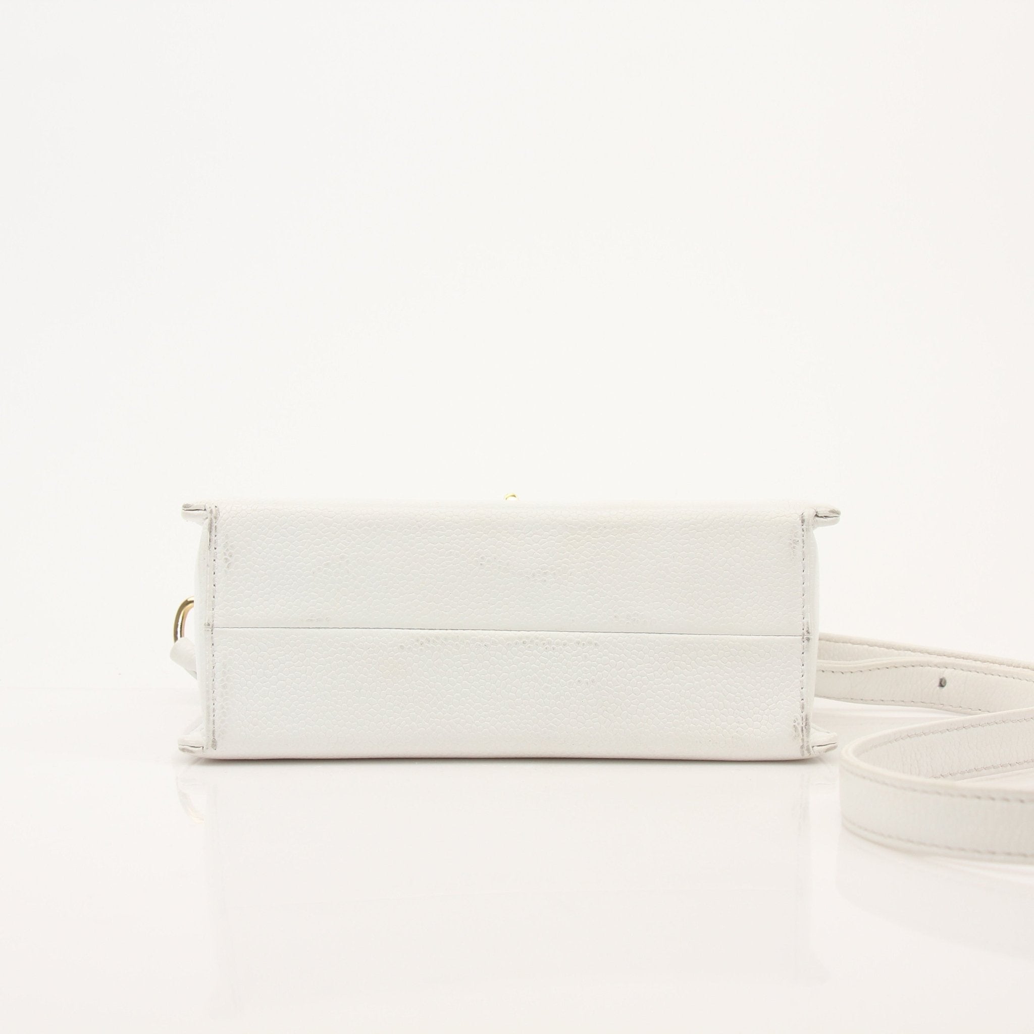 Chanel white caviar leather crossbody handbag with gold chain strap and quilted design, stylish and elegant for everyday use.