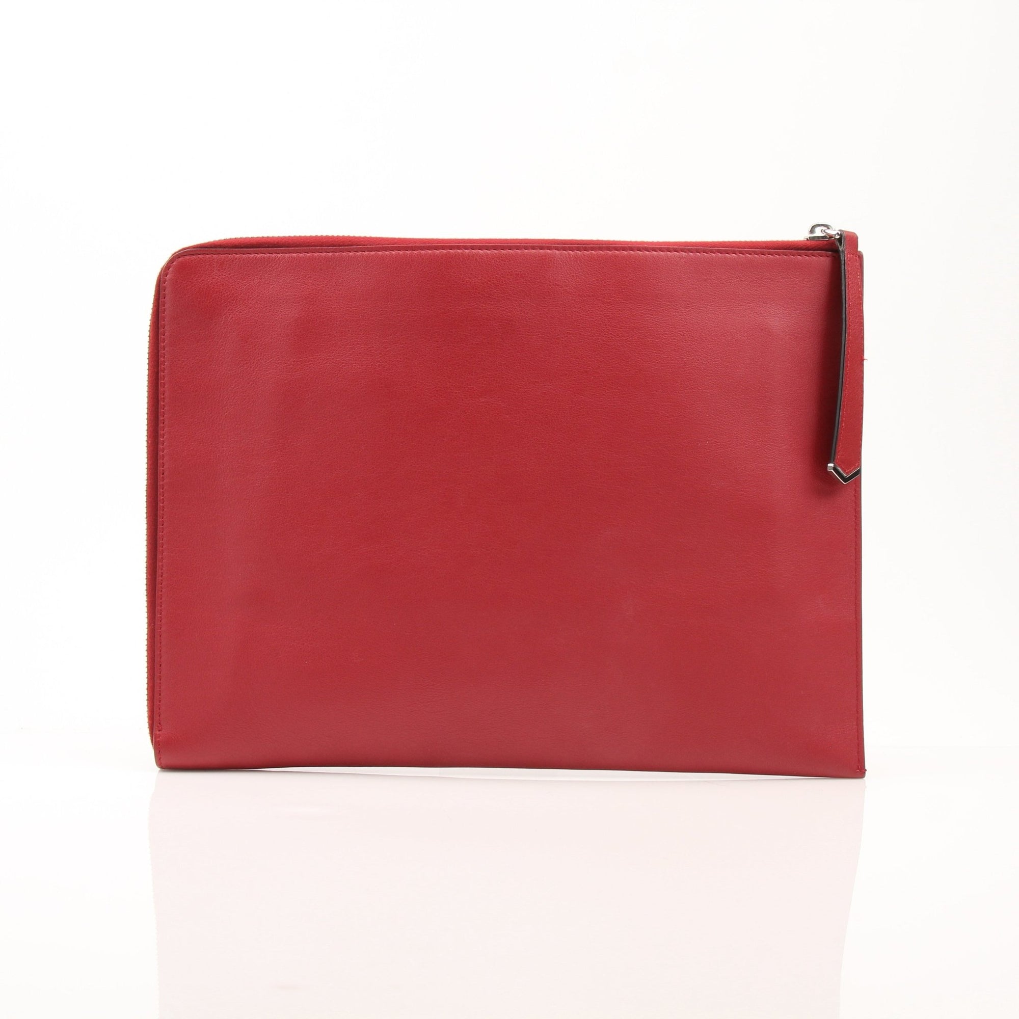 Gold & Beyond Fendi Monster wristlet clutch with bold design, featuring the iconic monster motif and wrist strap.