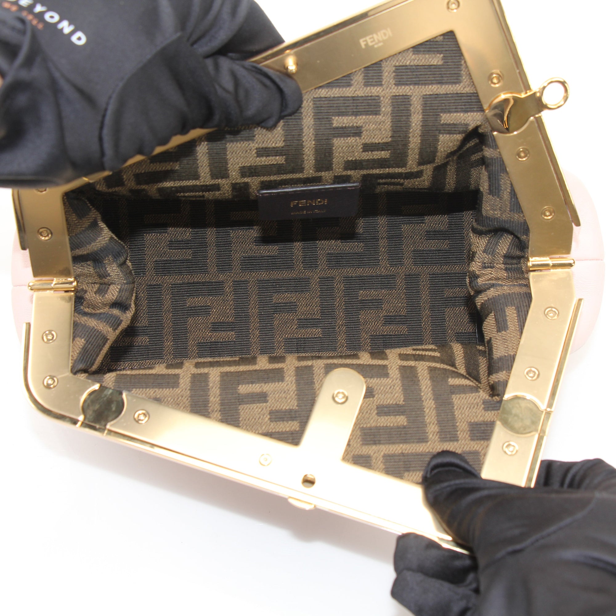 Gold & Beyond Fendi First Small Clutch handbag with sleek design and compact size, perfect for elegant accessories.