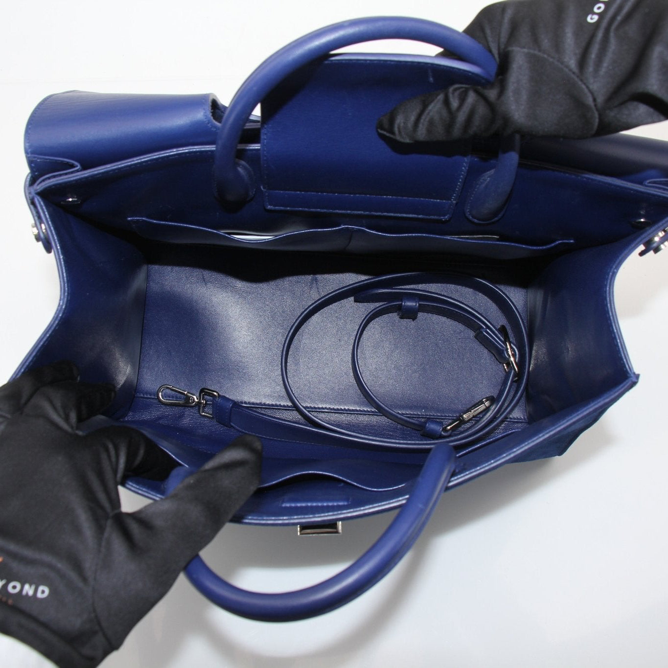 Gold & Beyond DiorEver large top handle handbag with structured design and elegant leather finish.