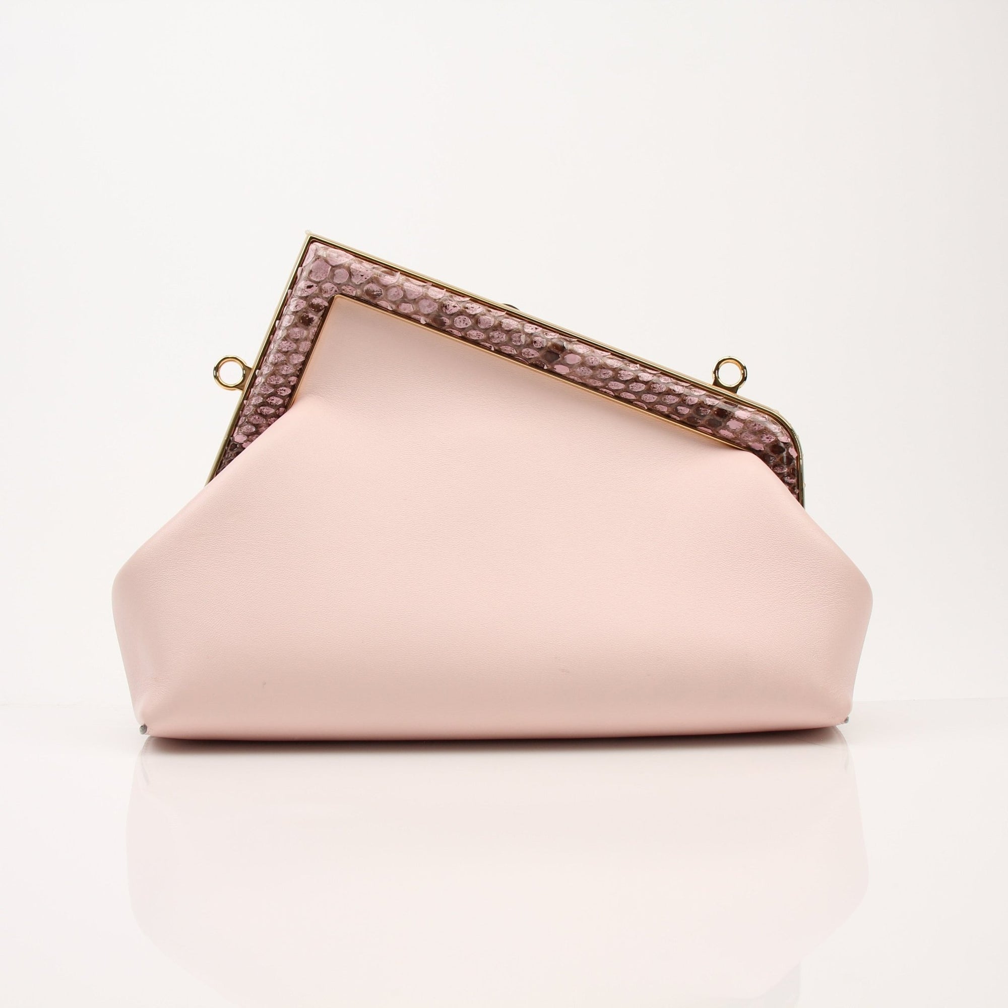 Fendi First small clutch handbag in black leather with gold hardware, featuring a sleek and compact design.