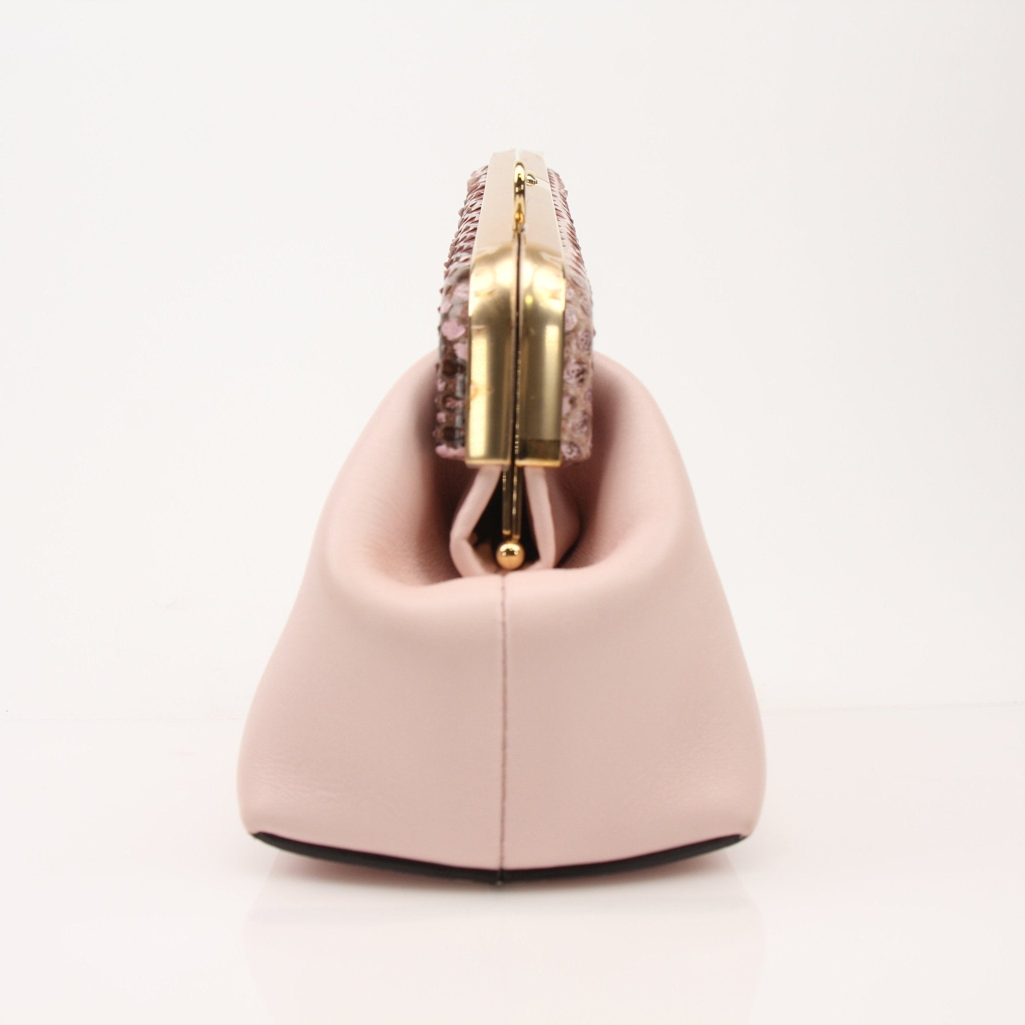 Small Fendi First clutch handbag in gold with sleek design and subtle logo details, perfect for elegant evening wear.