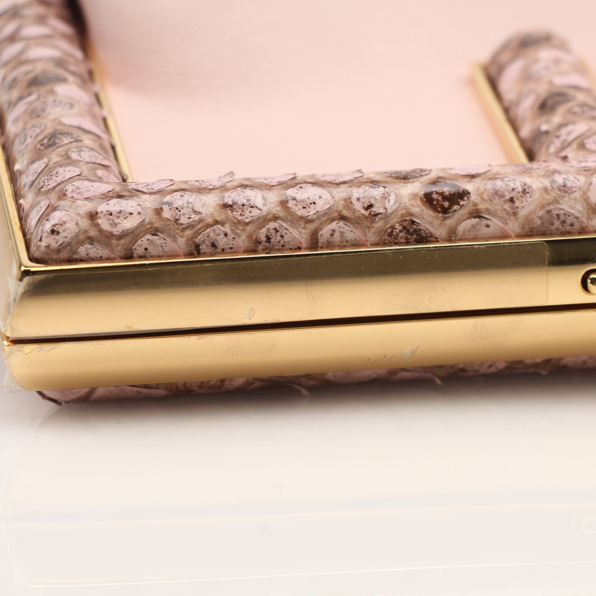 Fendi First Small Clutch handbag by Gold & Beyond with sleek design and gold-tone hardware, shown on a neutral background.